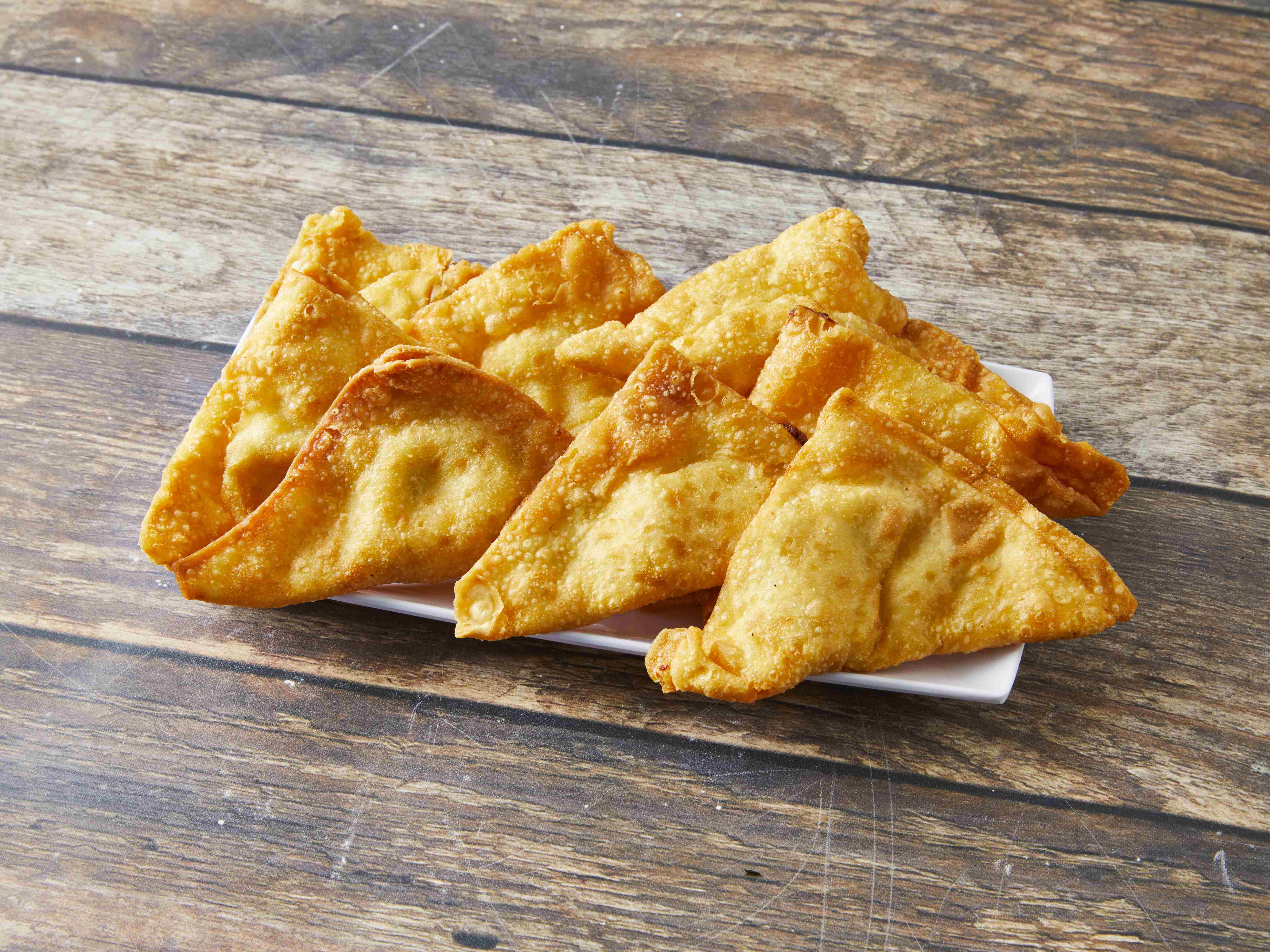 Order 107.  Crab Rangoon food online from Mr Ging Chop Suey store, Chicago on bringmethat.com