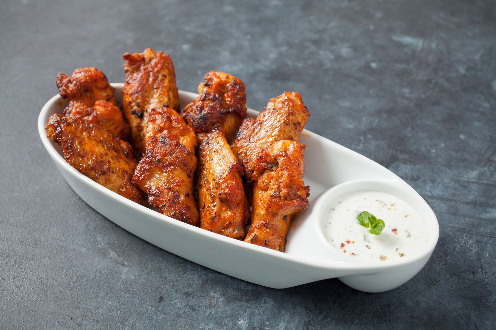 Order Classic Wings - 25 Piece (Max 3 Flavors) food online from Pizza Fuego store, San Bernardino on bringmethat.com