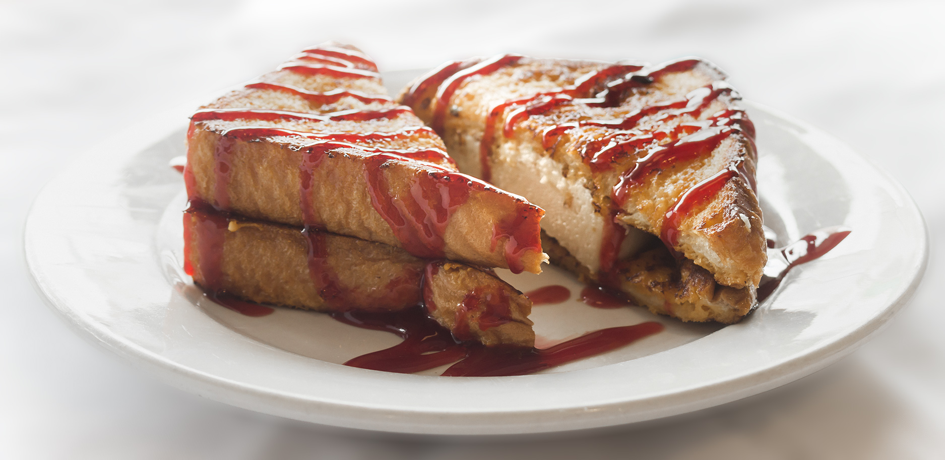 Order Raspberry Stuffed French Toast food online from Golden Apple Restaurant store, Chicago on bringmethat.com