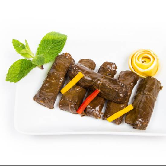 Order Home Made Grape Leaves (6pcs) food online from Fadi's Mediterranean Grill store, Houston on bringmethat.com