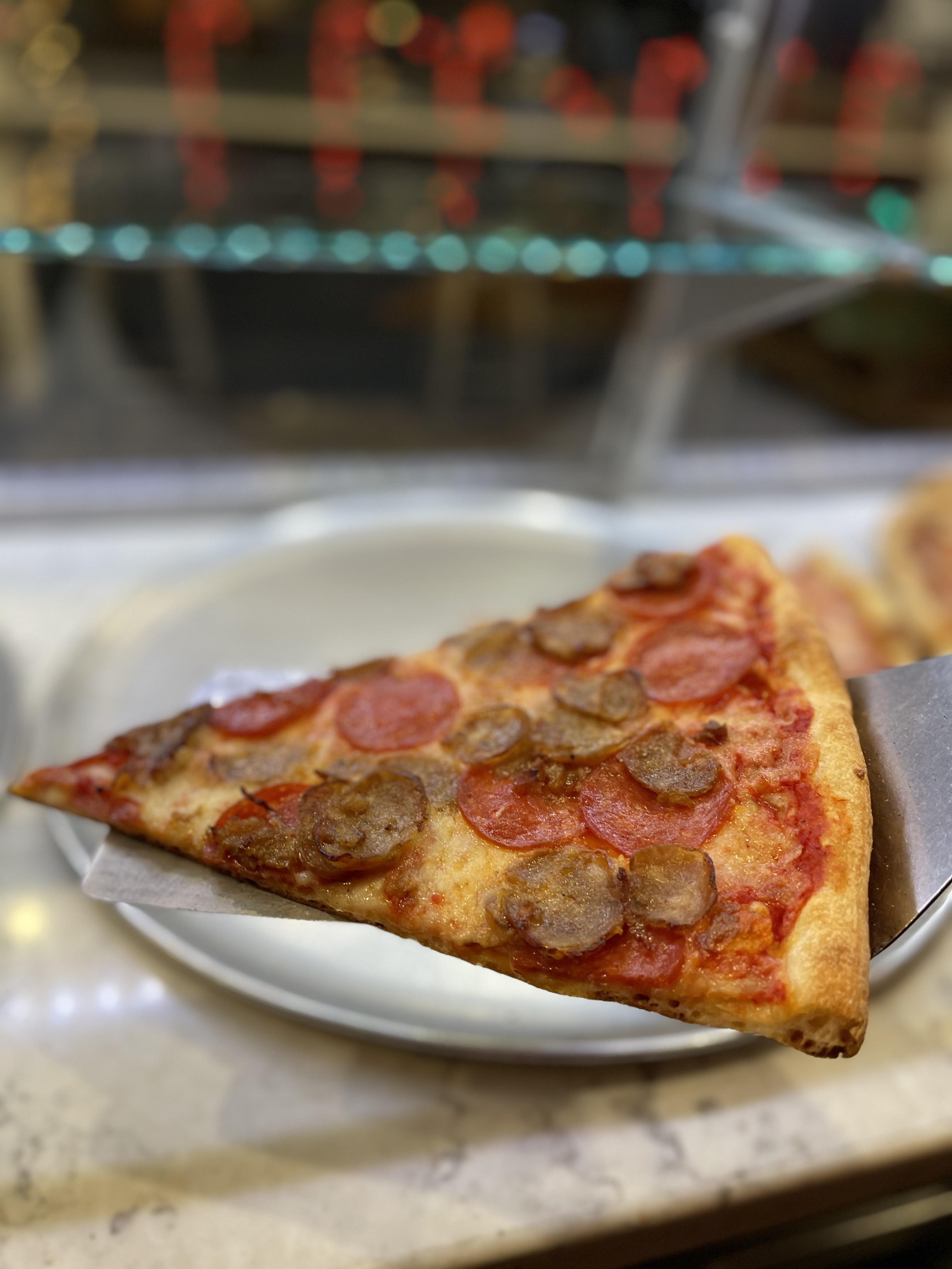 Order Pepperoni & Sausage Slice food online from Famous famiglia pizza store, New York on bringmethat.com