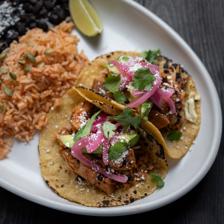 Order Carnitas Yucatecas Tacos food online from Cactus Restaurant store, Seattle on bringmethat.com