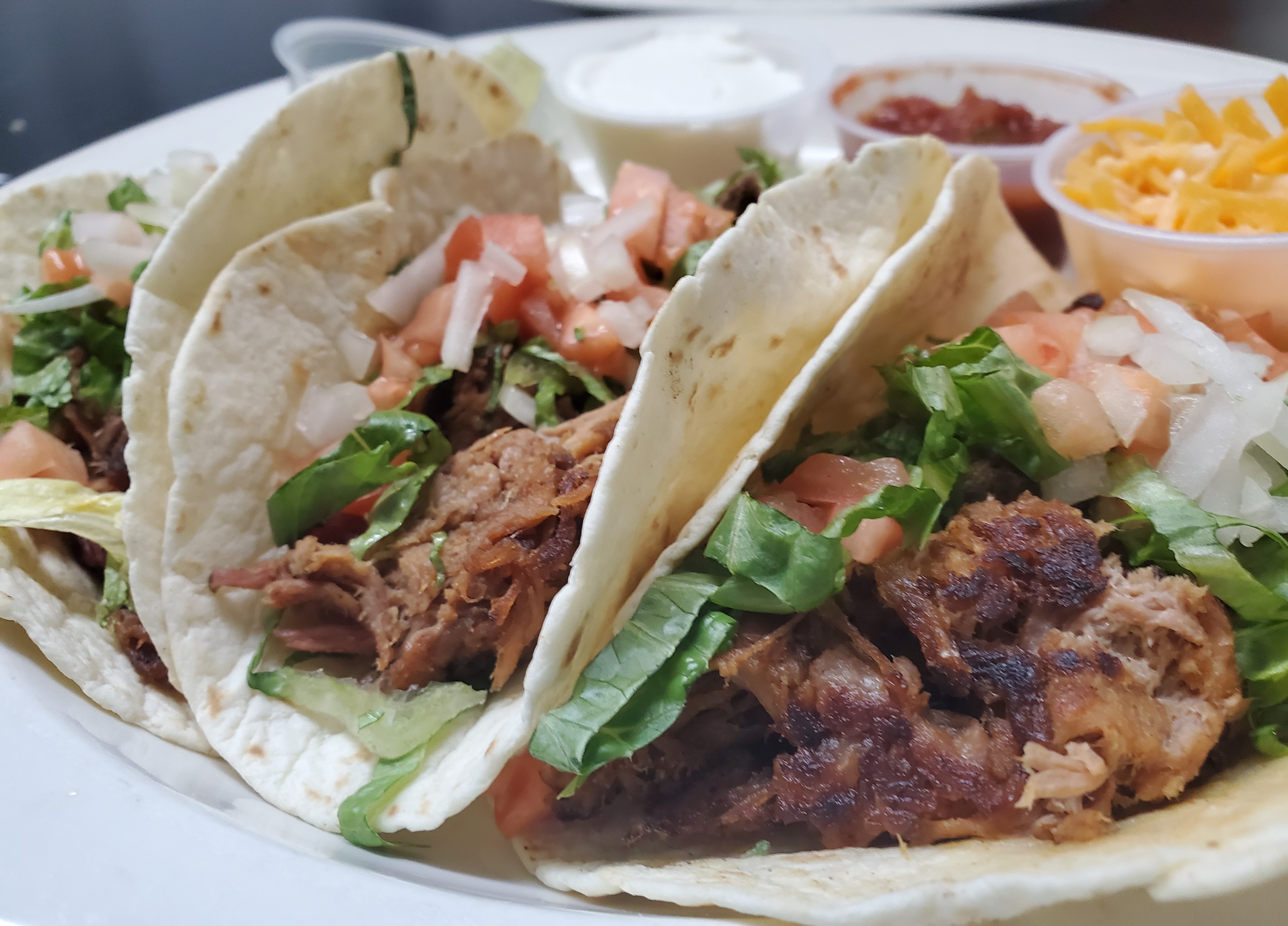 Order 3 Pork Tacos  food online from Juanito Mexican Grill store, Riviera Beach on bringmethat.com
