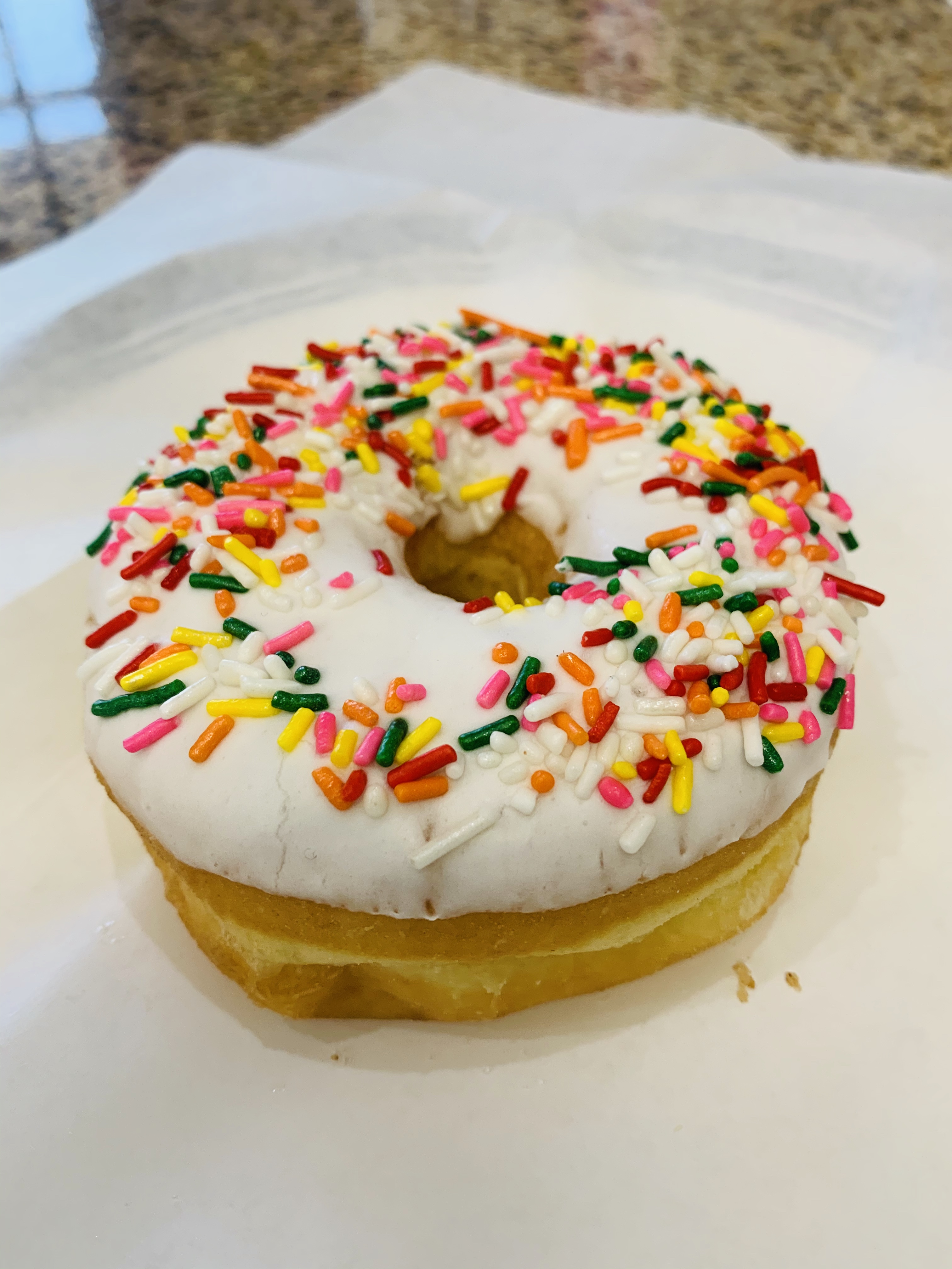 Order Vanilla Sprinkle Donut food online from Bosa Donuts store, Surprise on bringmethat.com