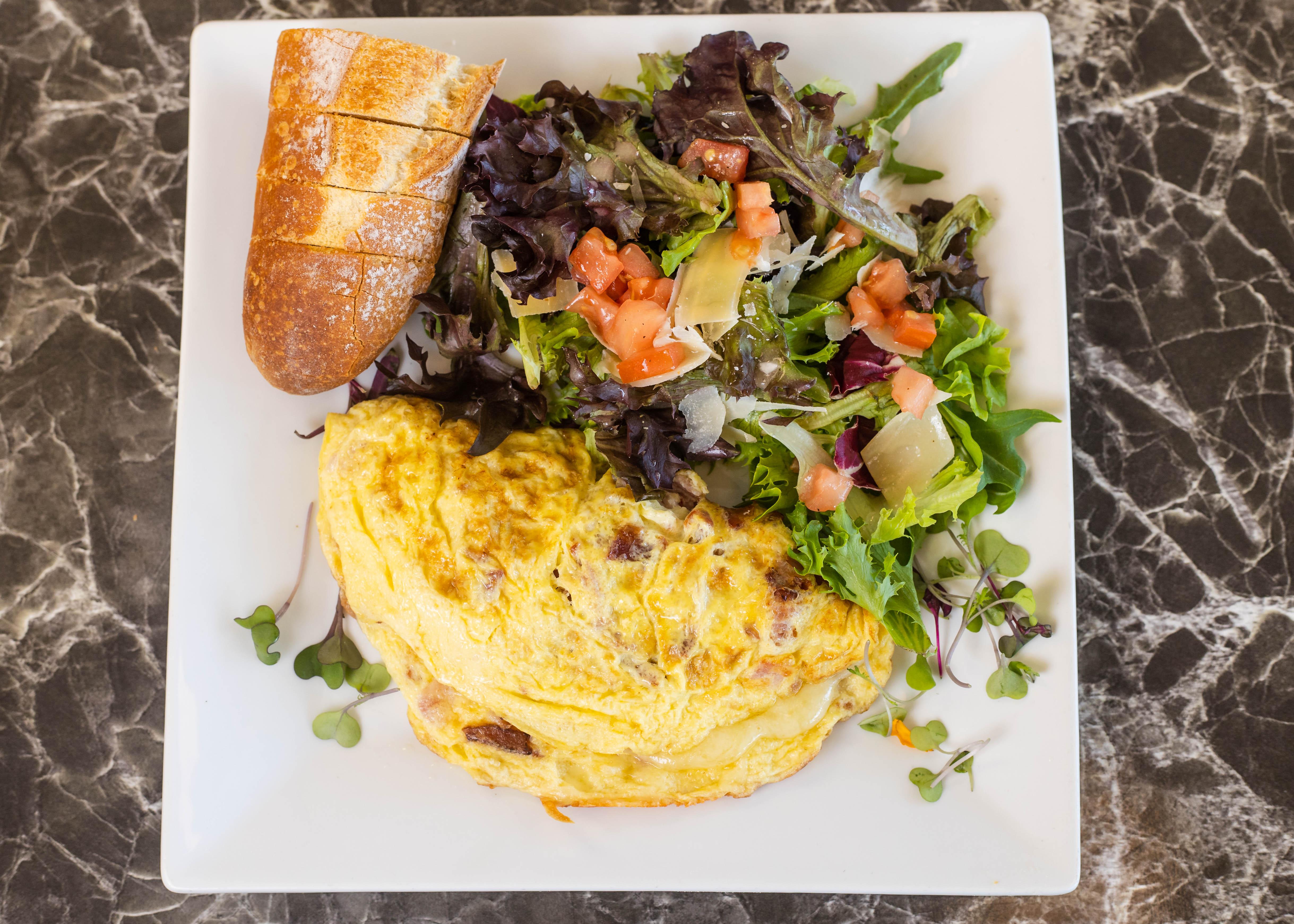 Order Ham, Bacon & Cheese Omelette food online from Rendez Vous store, Corona Del Mar on bringmethat.com