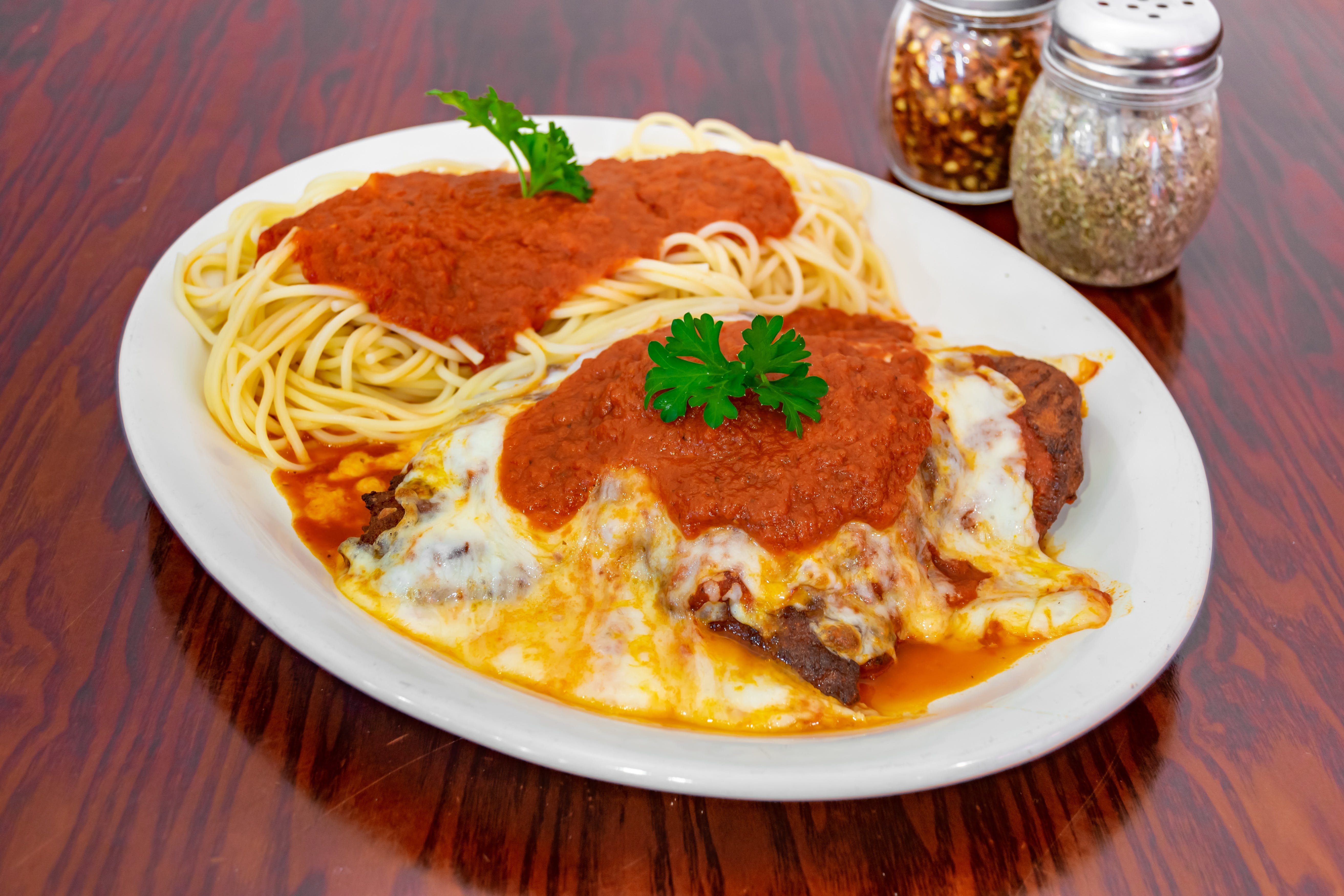 Order Chicken Parmigiana - Dinner food online from Giovannis Pizzeria store, Levittown on bringmethat.com