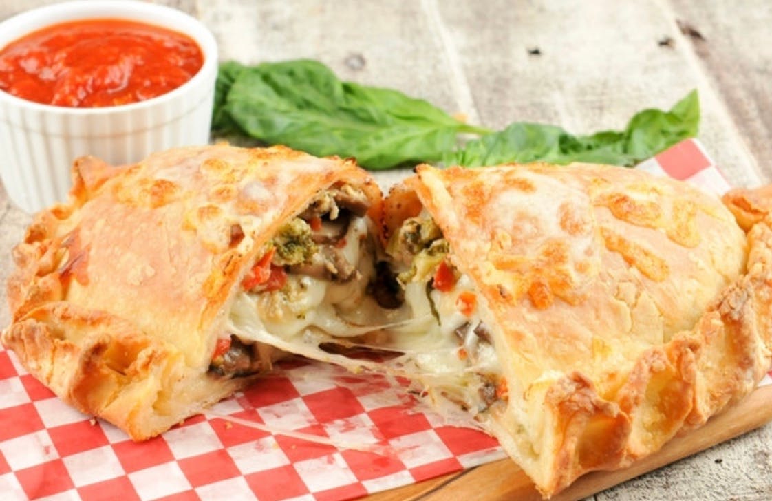 Order Veggie Calzone - Calzone food online from Buongiorno Pizza store, Windsor Mill on bringmethat.com