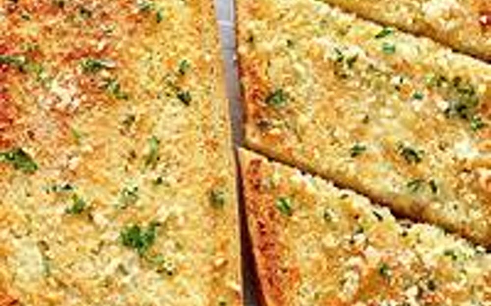 Order Garlic Bread - Appetizer food online from Pino's Pizzeria store, Easton on bringmethat.com