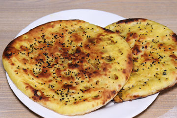 Order Achari Naan food online from Shimla Peppers store, Naperville on bringmethat.com