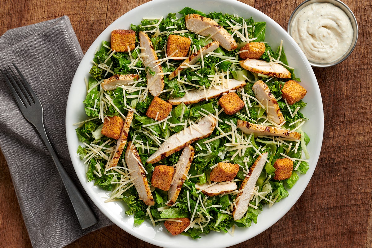 Order CHICKEN CAESAR SALAD food online from 54th Street Grill and Bar store, Arnold on bringmethat.com