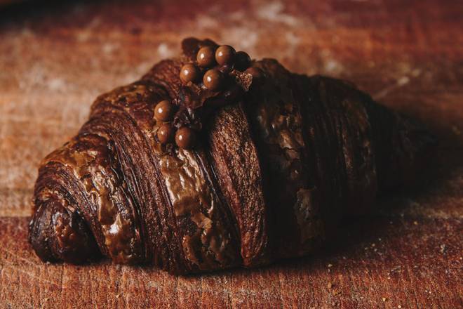 Order Double chocolate croissant food online from Badolina Bakery &amp; Cafe store, Houston on bringmethat.com