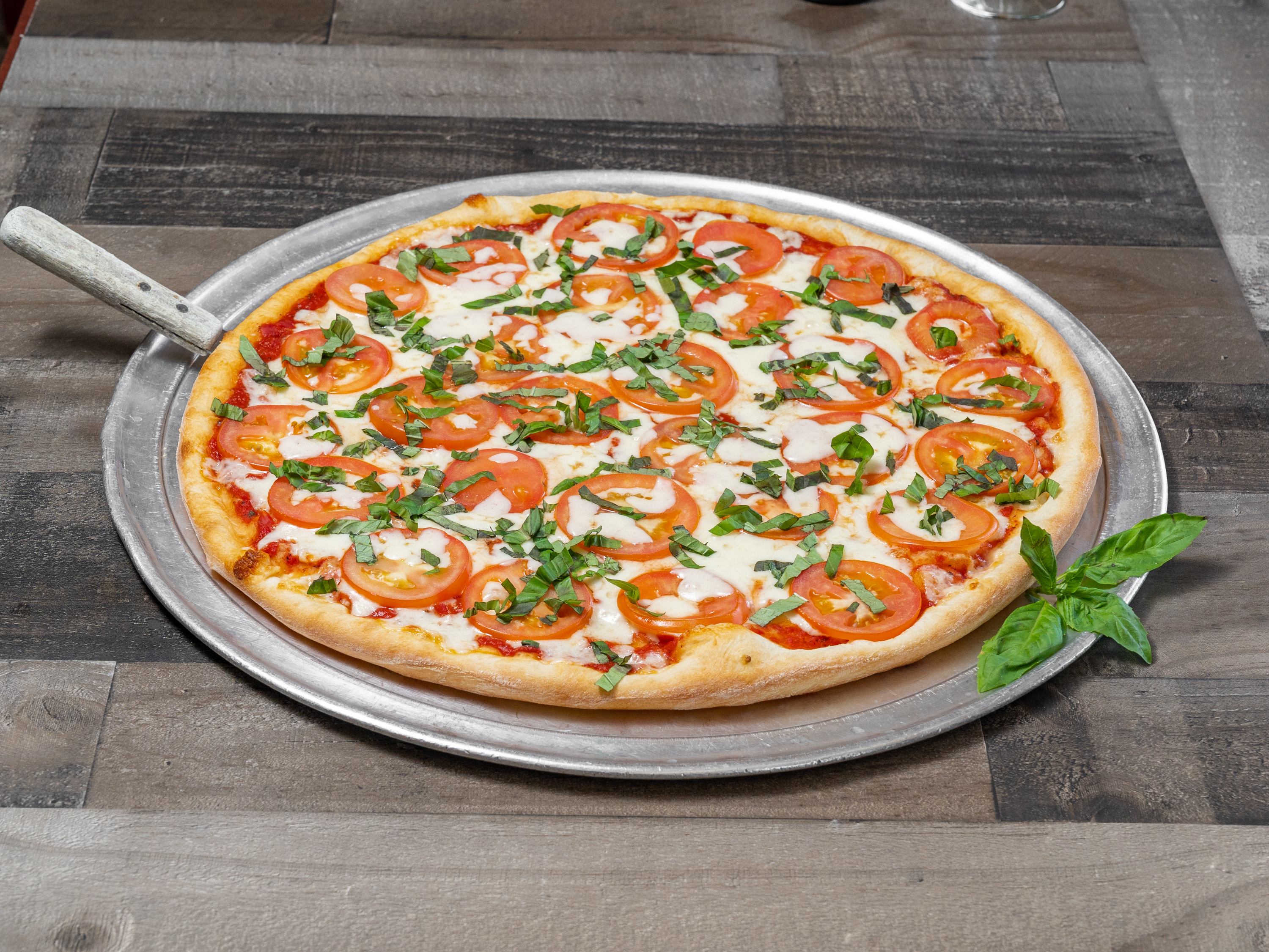 Order Margarita Pizza food online from Sal's Pizza store, Dallas on bringmethat.com