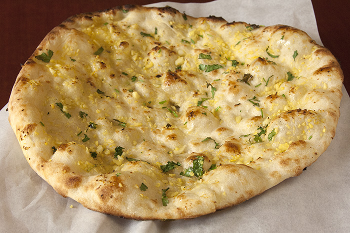 Order Garlic Naan food online from The Naan Wrap store, San Francisco on bringmethat.com