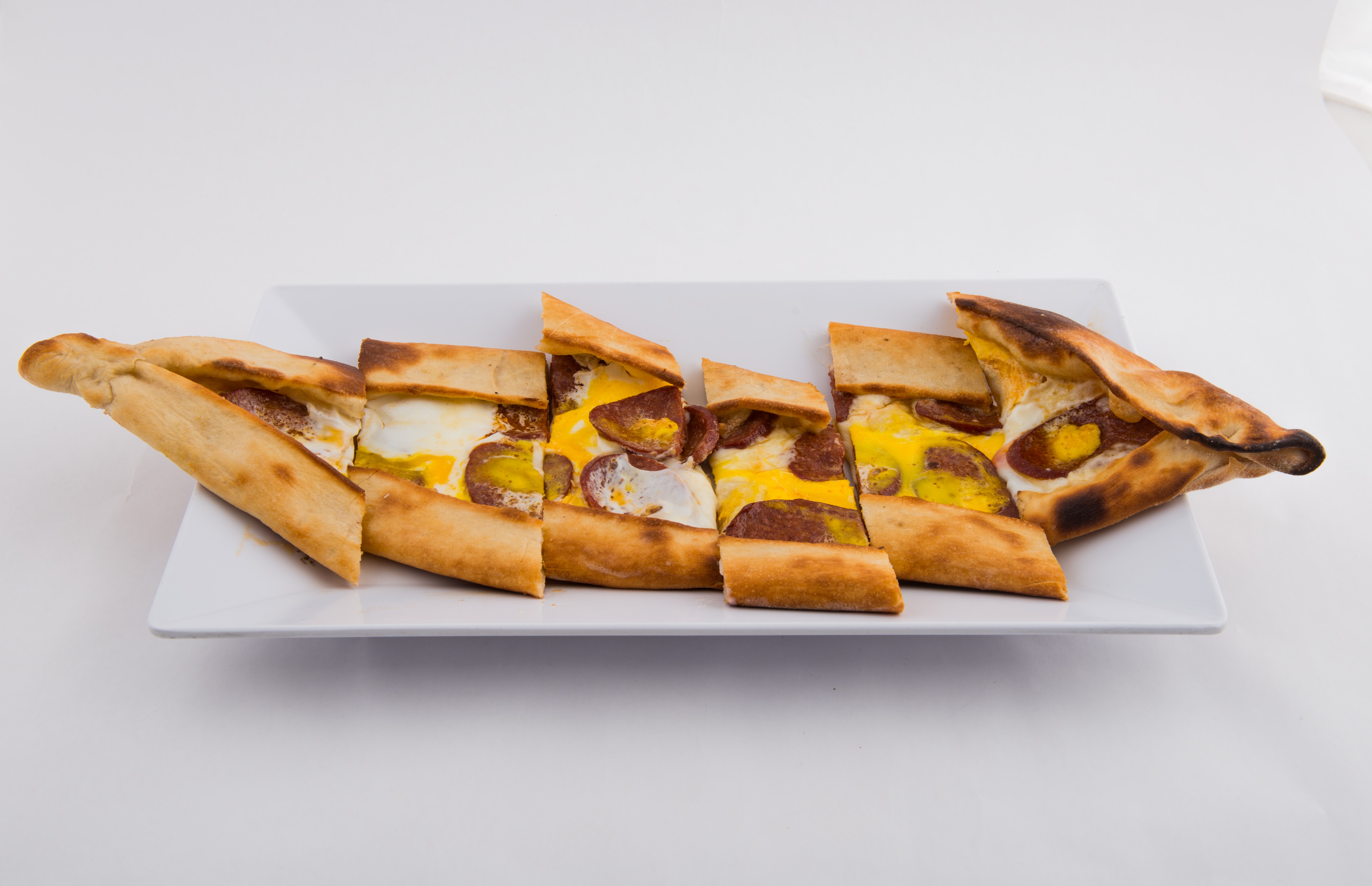 Order Egg and Sucuk Pide food online from Mangal Kabob  store, Sunnyside on bringmethat.com