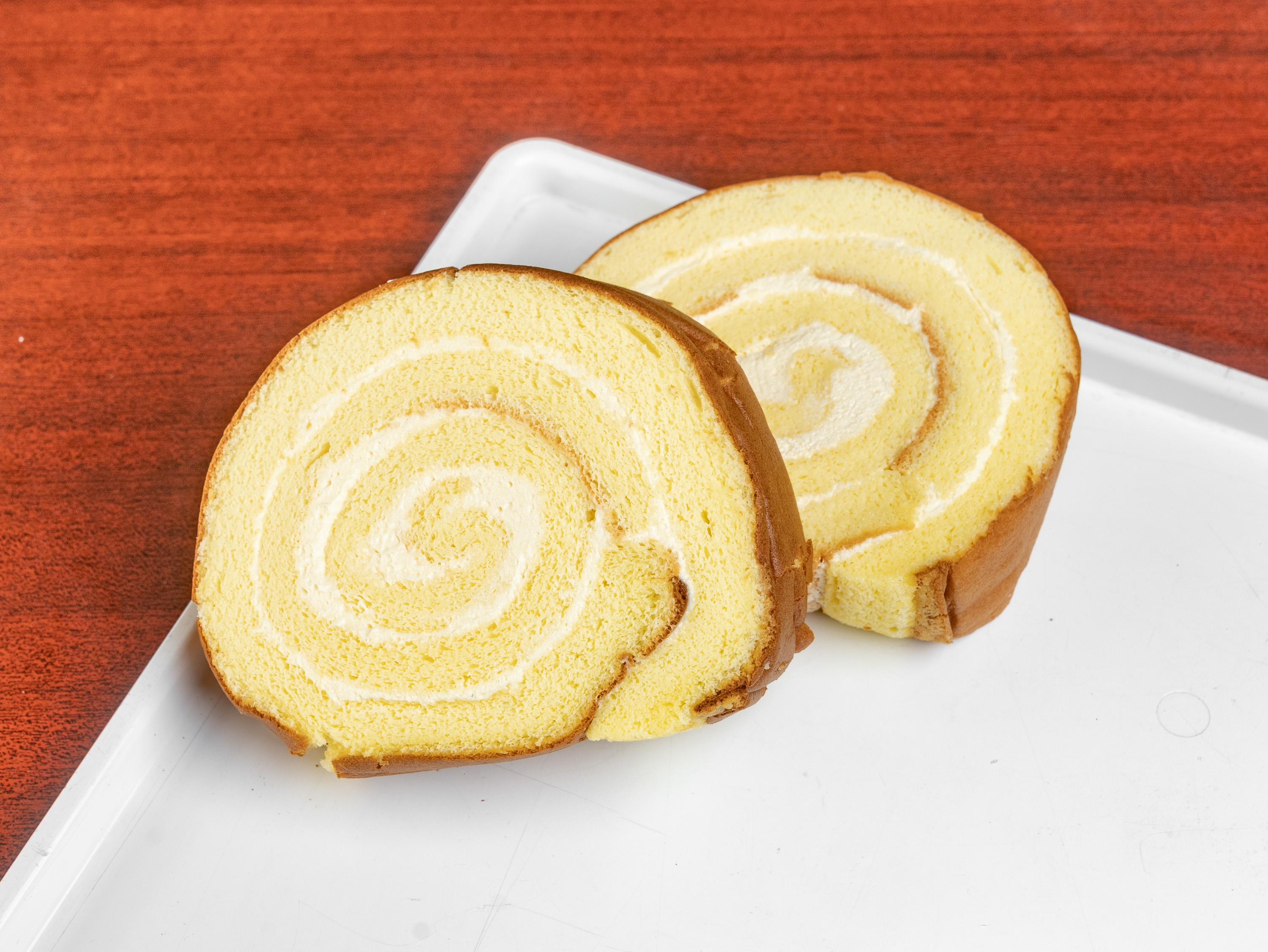 Order 2 Slice of Cream Swiss Roll food online from Cherry Blossom Bakery store, San Francisco on bringmethat.com