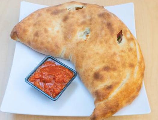 Order Spinach Calzone - Calzone food online from Magura Pizza store, Las Vegas on bringmethat.com