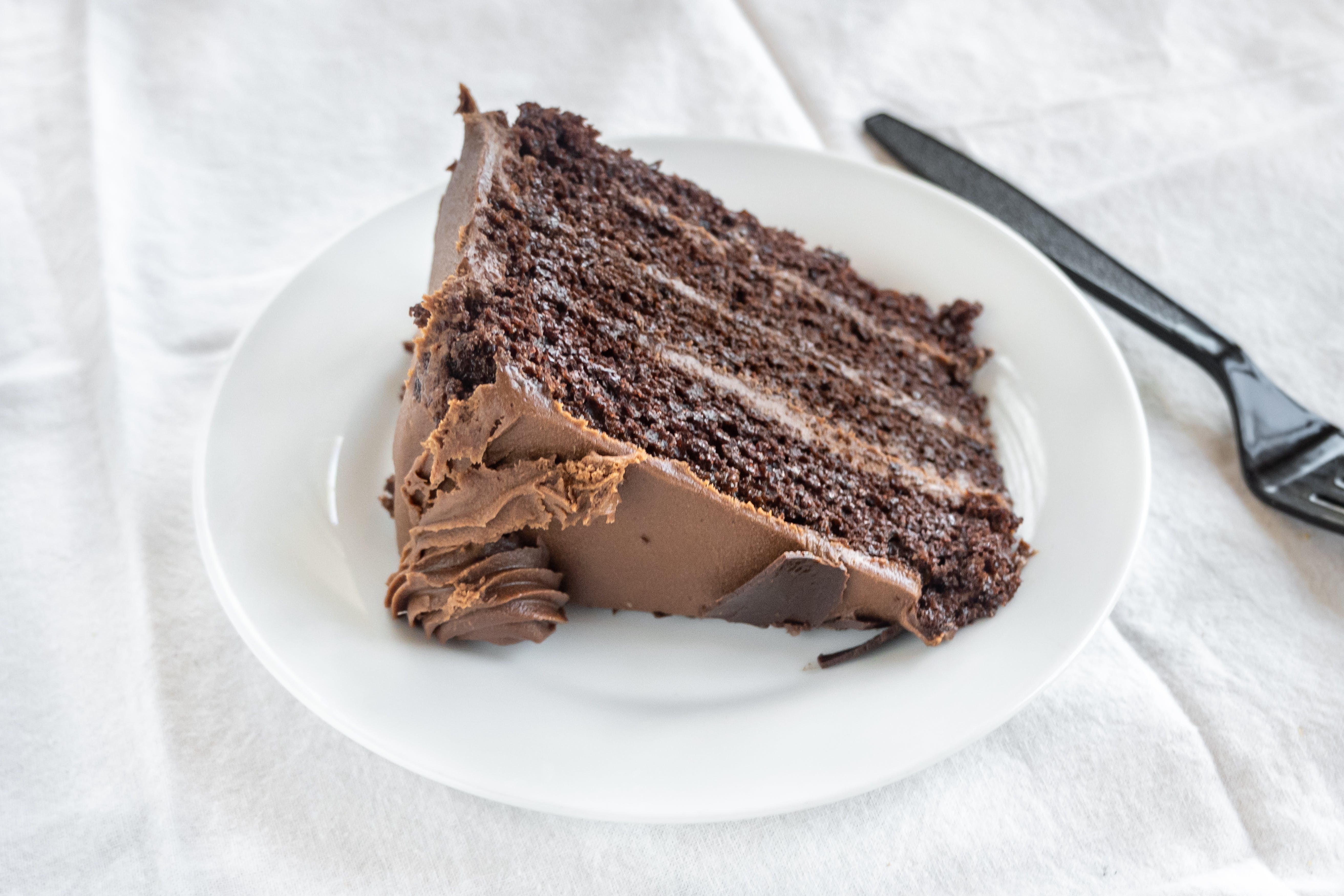 Order Chocolate Cake - Dessert food online from New Tiny's Grill store, Media on bringmethat.com