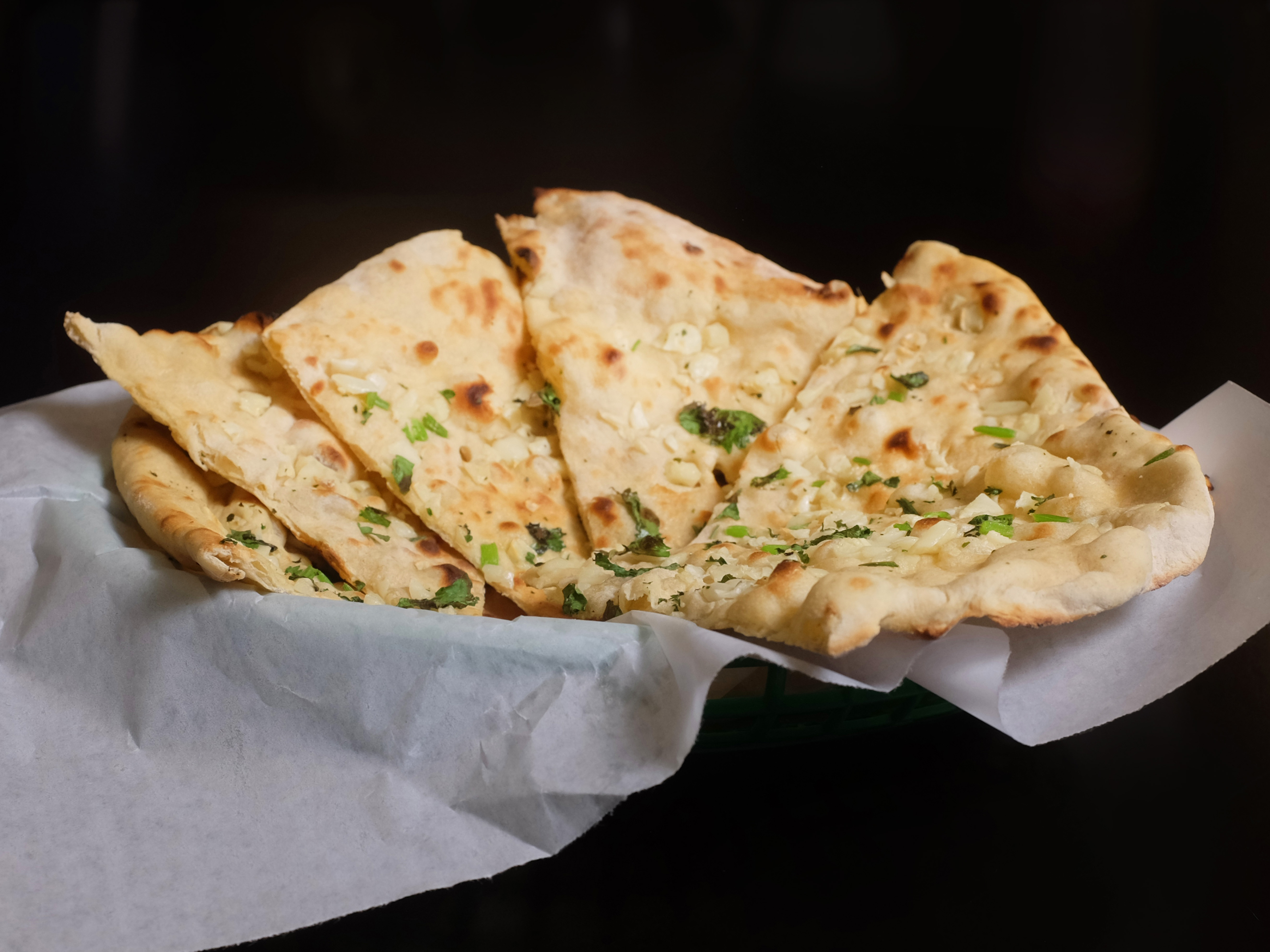 Order 3.) Garlic Naan food online from New Paradise store, Wichita on bringmethat.com