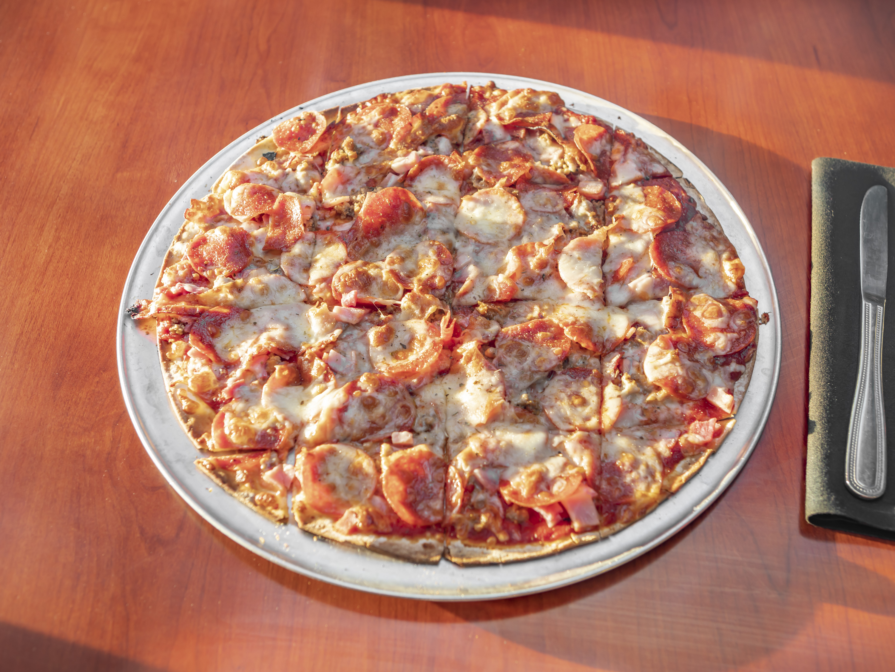 Order Mega Meat Lovers Pizza food online from Firehouse Bar & Grill store, St. Louis on bringmethat.com