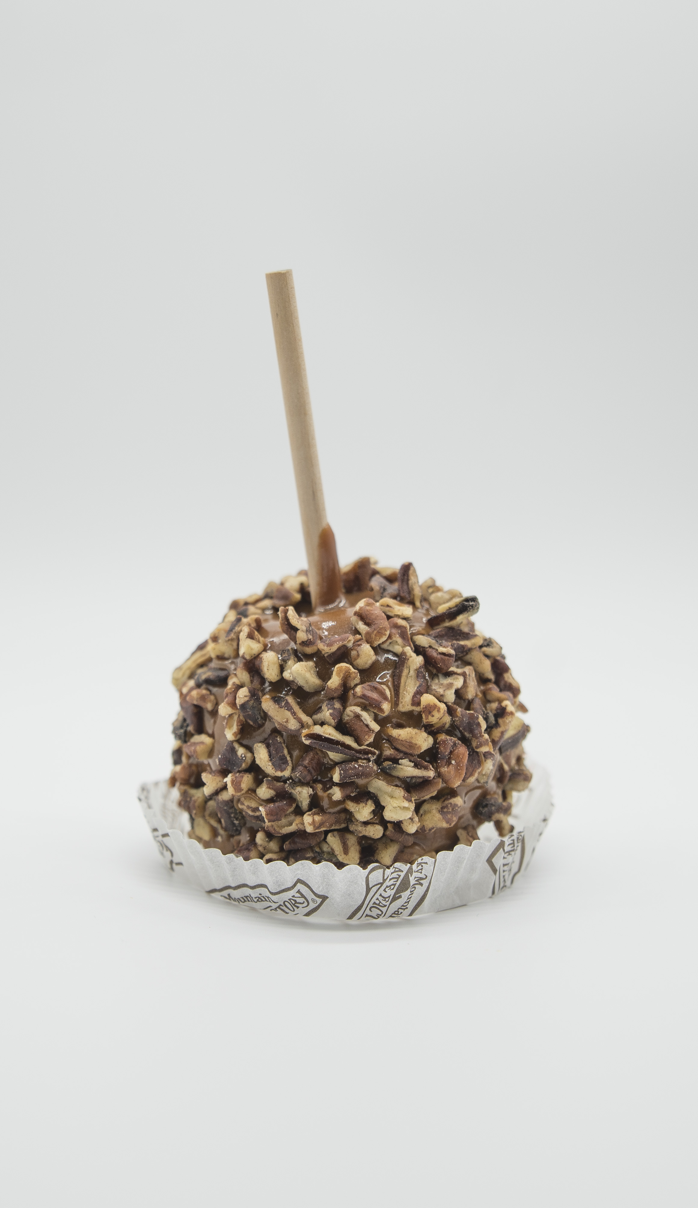 Order Pecan Caramel Apple food online from Rocky Mountain Chocolate Factory store, Fresno on bringmethat.com