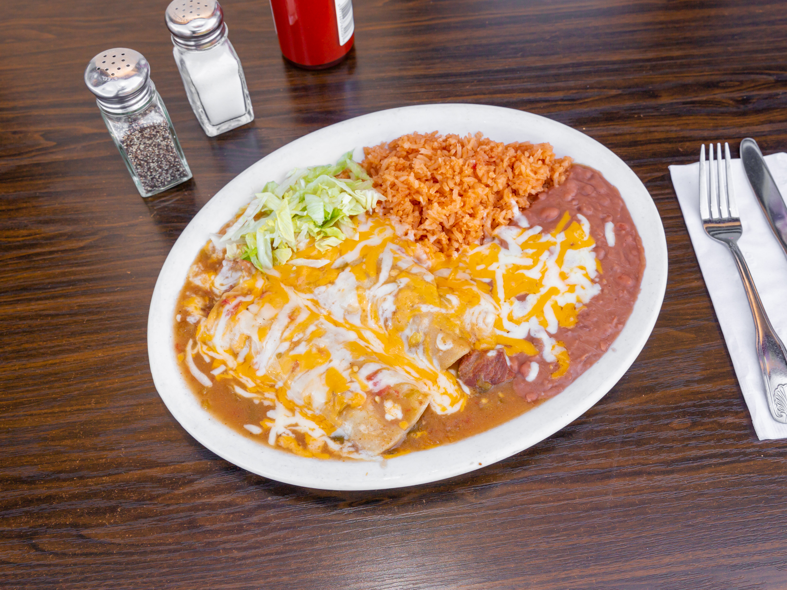Order 20. Two Green Chili Enchiladas Combo food online from Burnt Tortilla store, Gardena on bringmethat.com