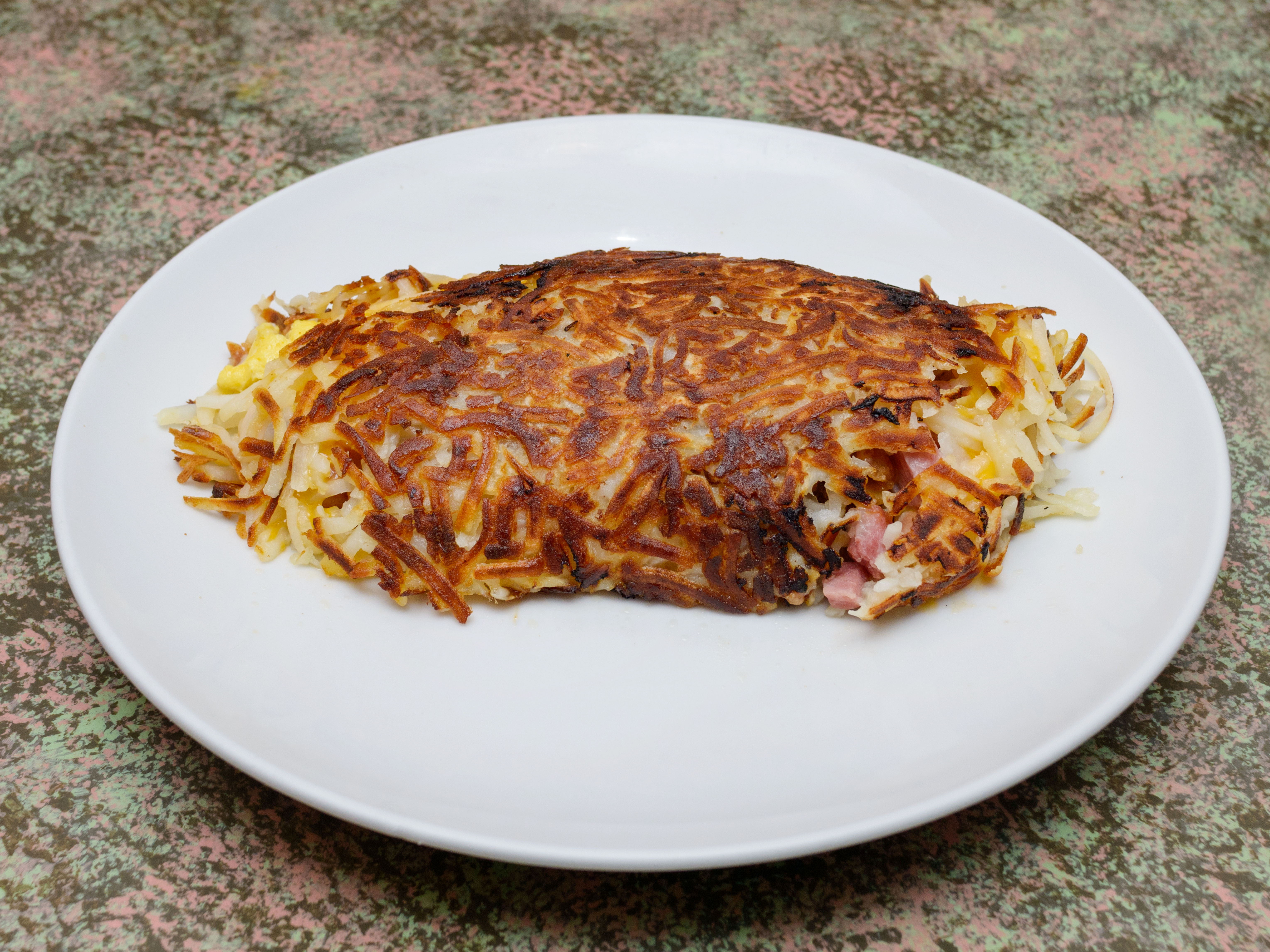 Order We’ll Meat in the Middle Spud Omelet food online from Gail Carriage Inn store, Des Plaines on bringmethat.com