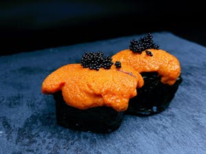 Order C18. Uni (Sea Urchin) Nigiri food online from Bengee Sushi store, Ontario on bringmethat.com