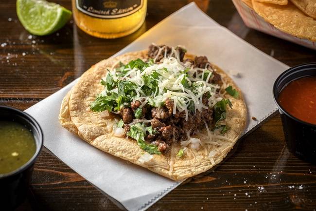Order House-Ground Marinated Steak Taco food online from Flacos Tacos store, Chicago on bringmethat.com