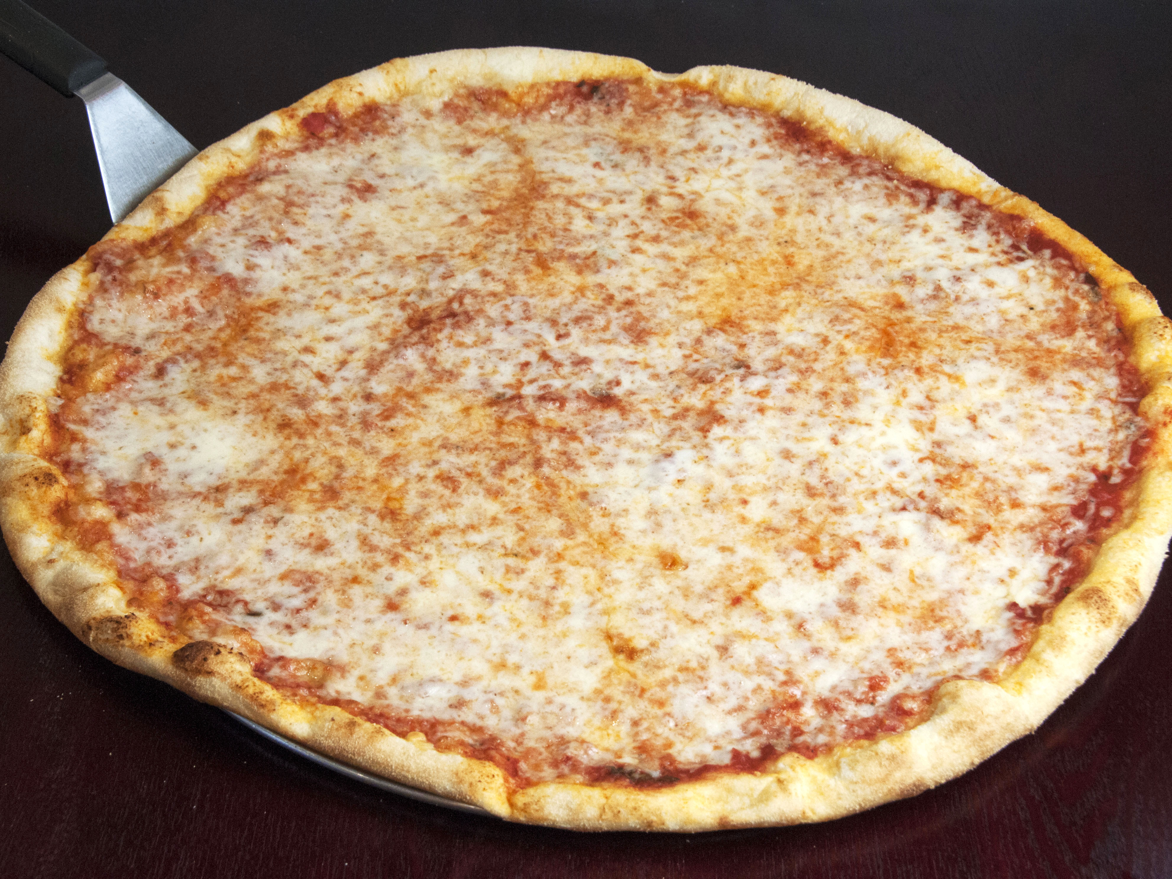 Order Cheese Pizza Slice food online from Pizza Stop store, New York on bringmethat.com