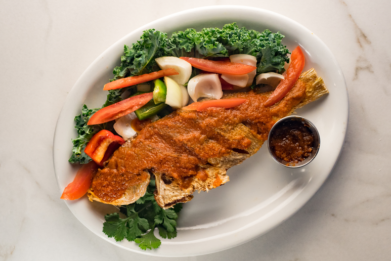 Order Whole Snapper food online from Cafe Songhai store, Norcross on bringmethat.com