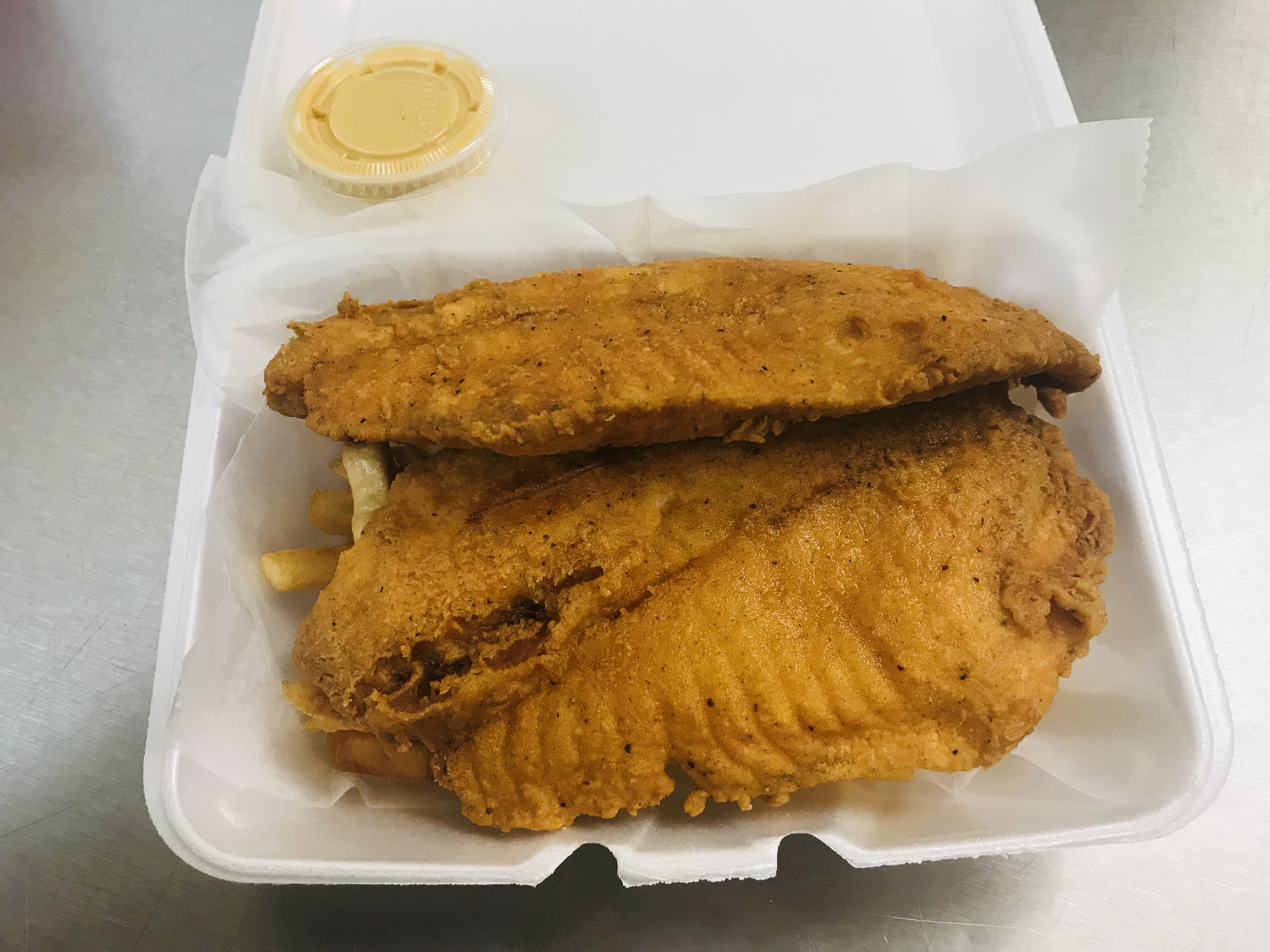 Order Fresh Tilapia with fries food online from A-1 Deli And Fried Chicken store, Wilmington on bringmethat.com