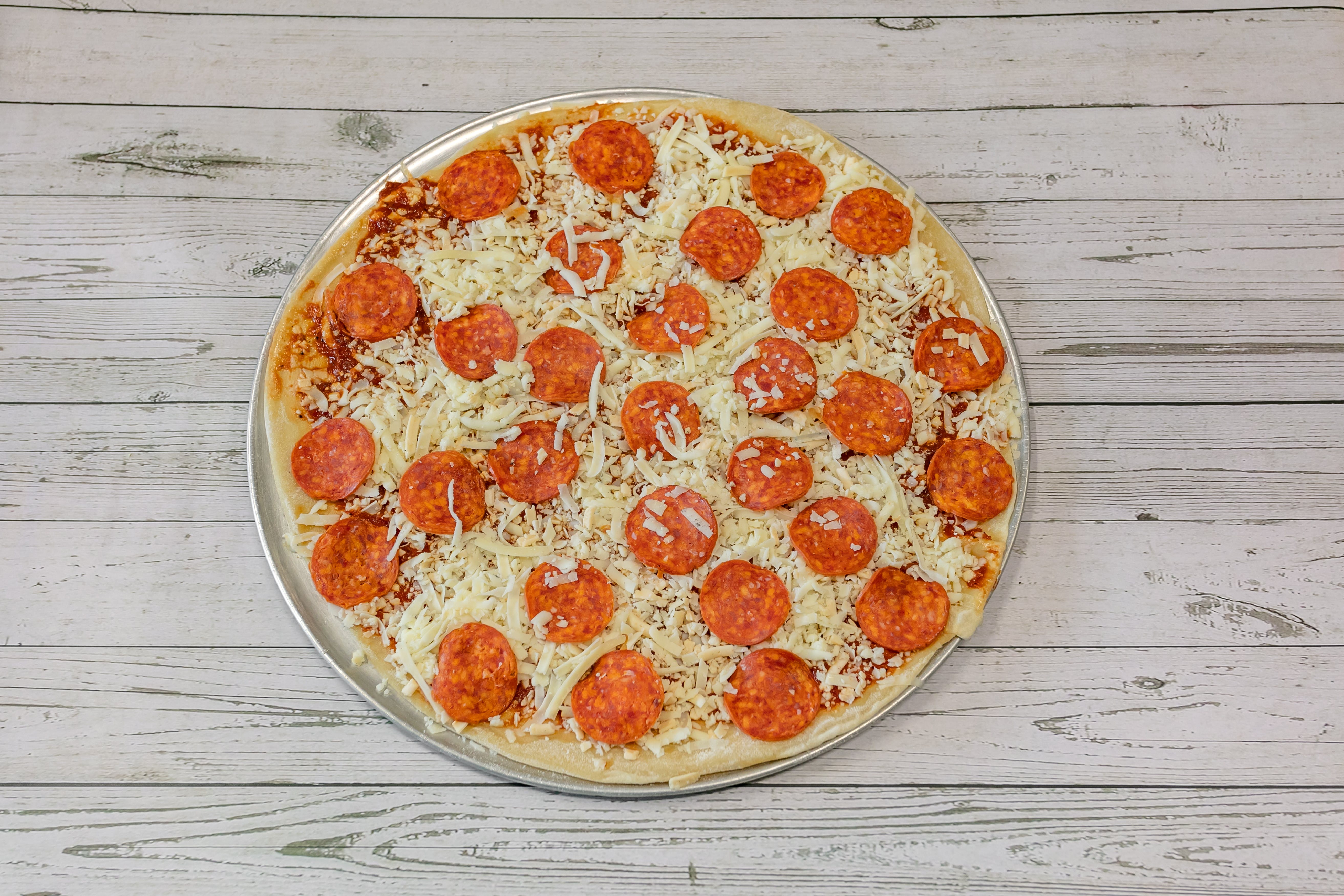 Order Pepperoni Pizza - Medium 14'' food online from Paws Pizza store, Marble Hill on bringmethat.com