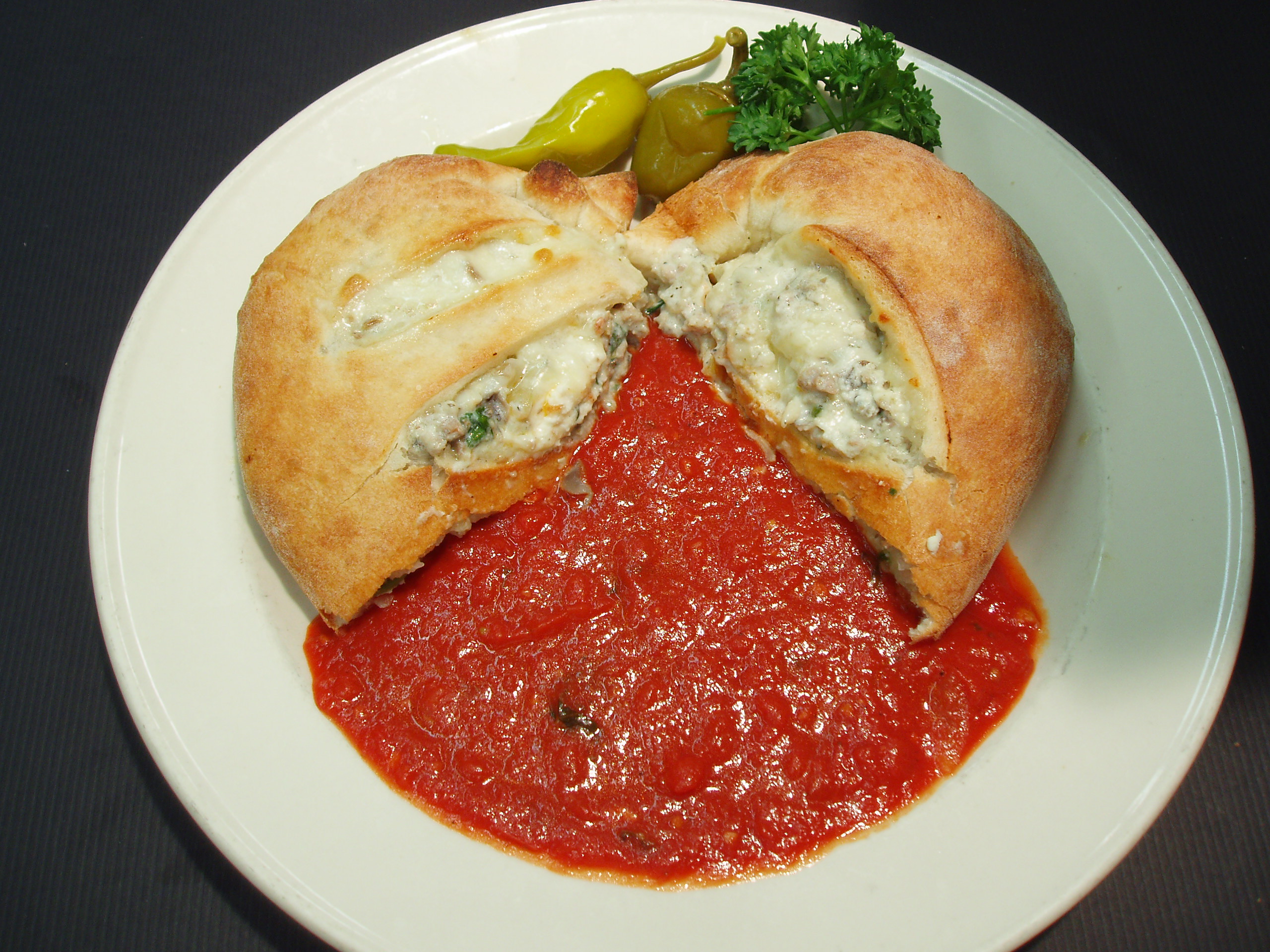 Order Italian Sausage Calzone food online from Giorgio's store, Milpitas on bringmethat.com