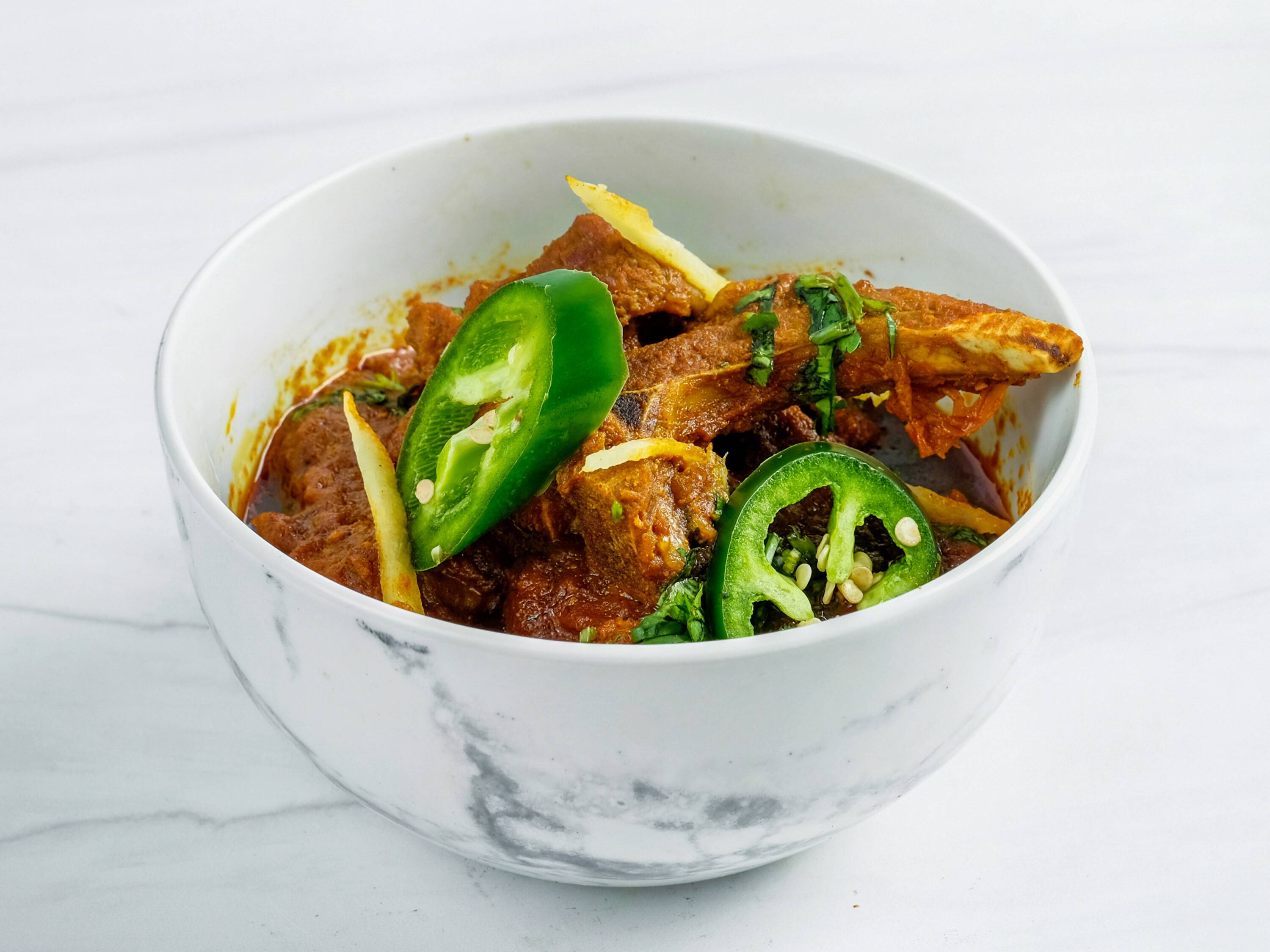 Order Chicken Karahi food online from Kwality Kabab & Grill store, Carrollton on bringmethat.com