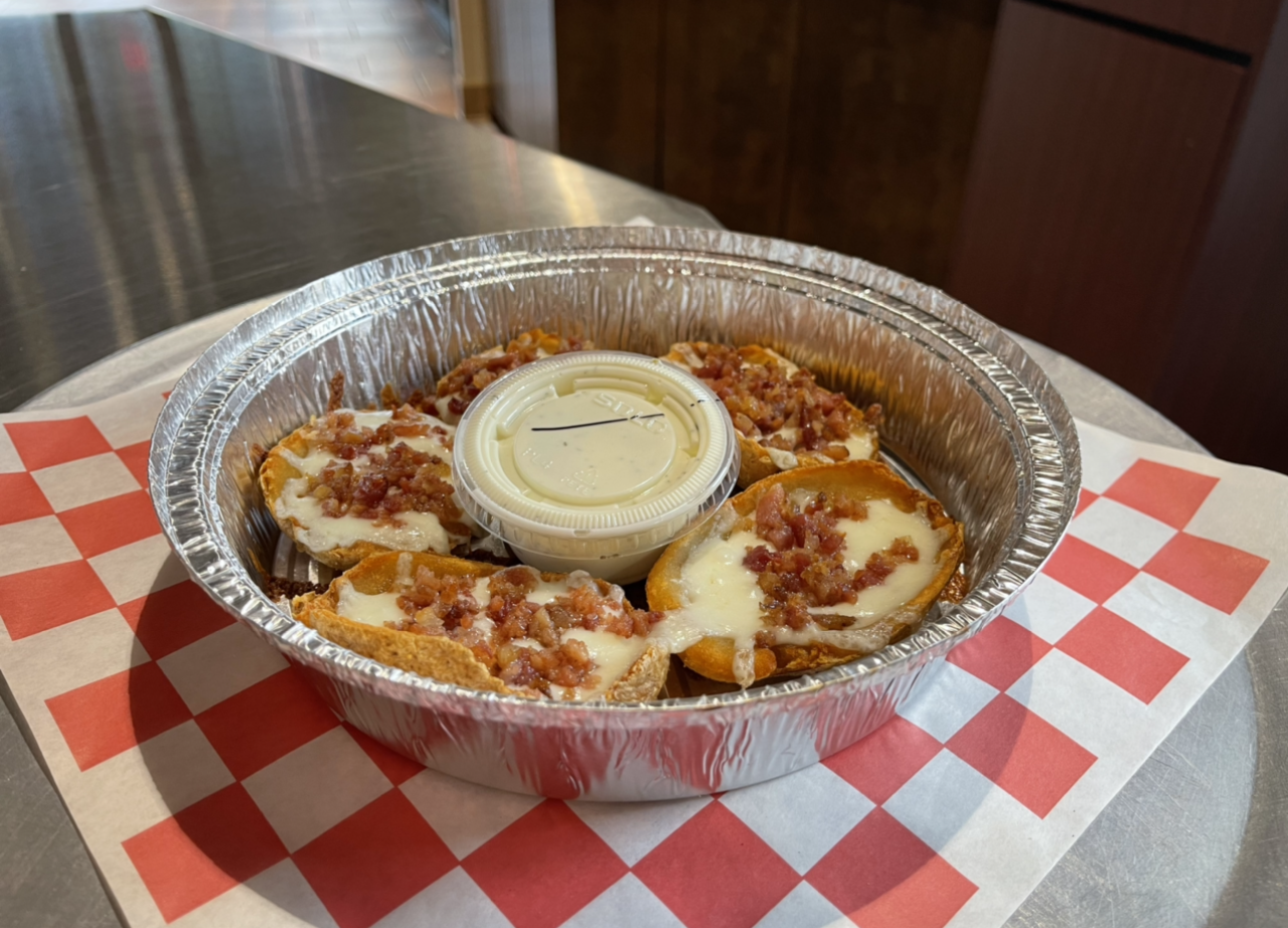 Order Giant Bacon and Cheese Potato Skins food online from Johnny's Pizza store, Cary on bringmethat.com