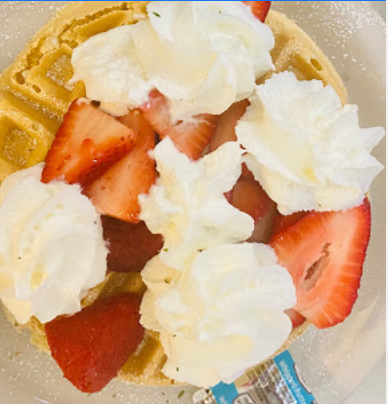 Order 9. A Vanilla Belgian Waffle with Eggs (3) & Bacon or Sausage food online from Bear Paw Cafe store, St. George on bringmethat.com