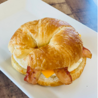 Order Fresh Baked Croissant Sandwich with Egg, Bacon, and Cheese  food online from Simply Vanilla Gourmet store, Lynchburg on bringmethat.com