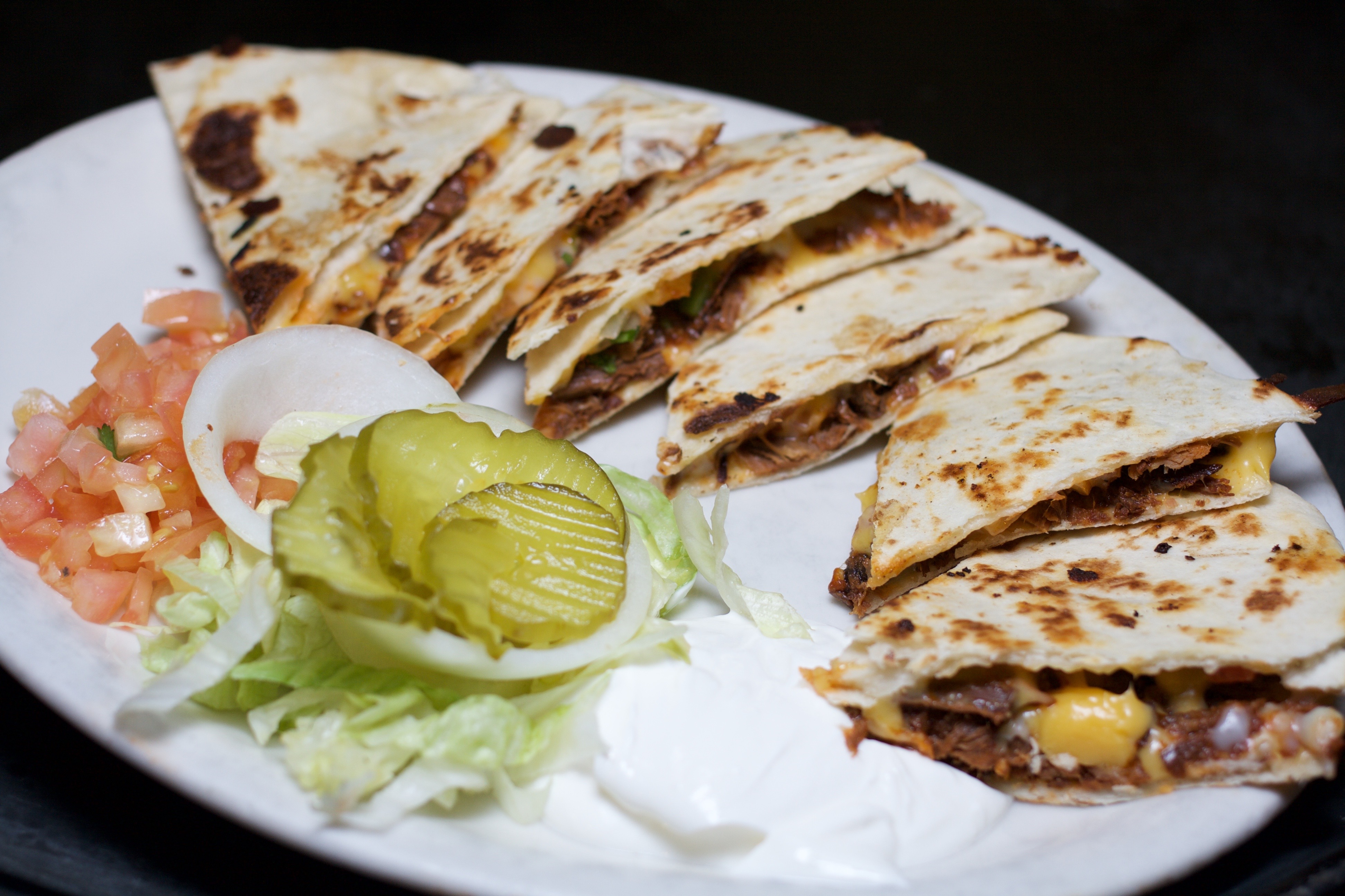 Order Brisket Quesadillas food online from Alamo Cafe store, San Antonio on bringmethat.com