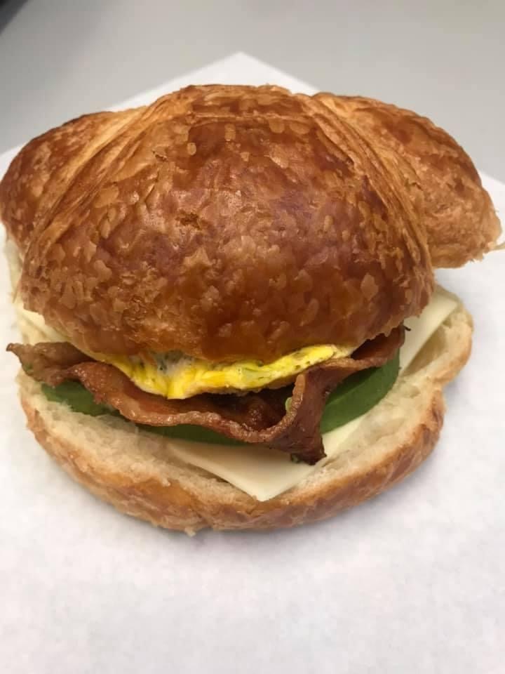 Order 17 Omelet Croissant with Bacon, Cheese and Avocado  food online from Michael Donuts store, Hungtington Beach on bringmethat.com