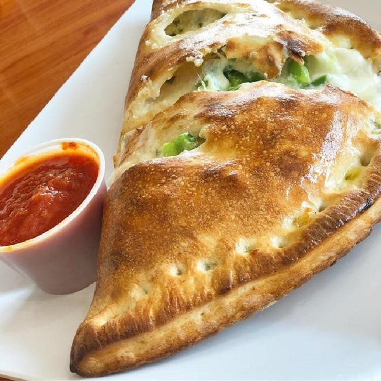 Order Veggie Calzone - Calzone food online from Carmelo's Pizza, Pasta, Subs & More!! store, Linthicum Heights on bringmethat.com