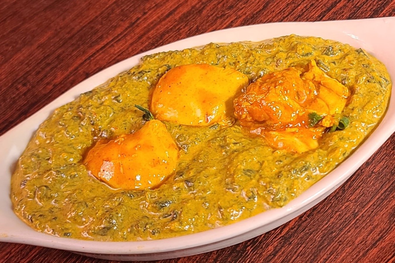 Order Chicken Saag food online from Royal Indian Cuisine store, San Francisco on bringmethat.com