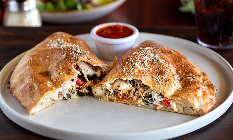 Order Stromboli food online from New York Pizzeria store, Pearland on bringmethat.com