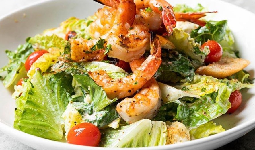 Order Caesar Salad food online from Pappadeaux Seafood store, Houston on bringmethat.com