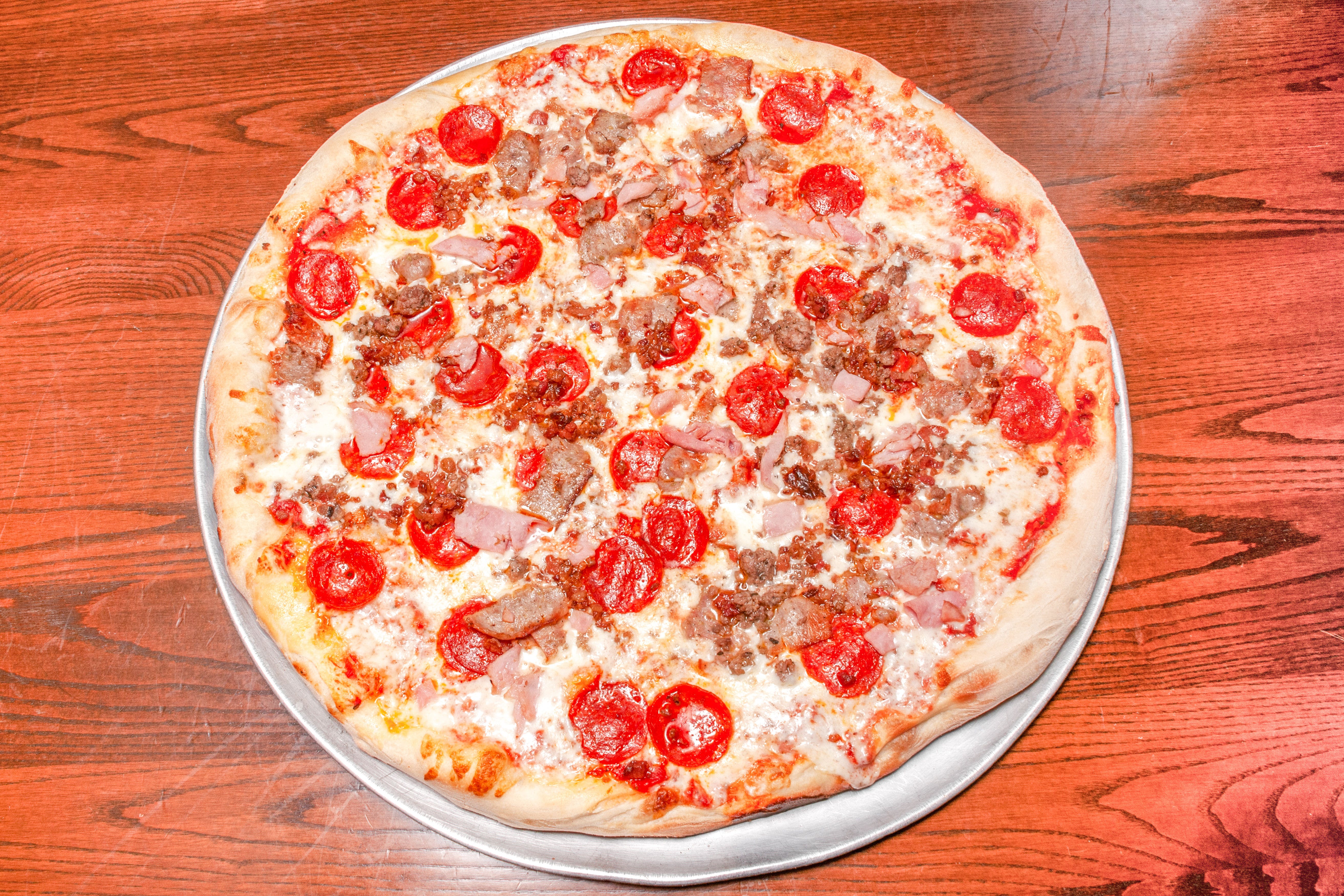 Order Meatlovers Pizza - 14" food online from Primo Pizza Ny Style store, Cary on bringmethat.com