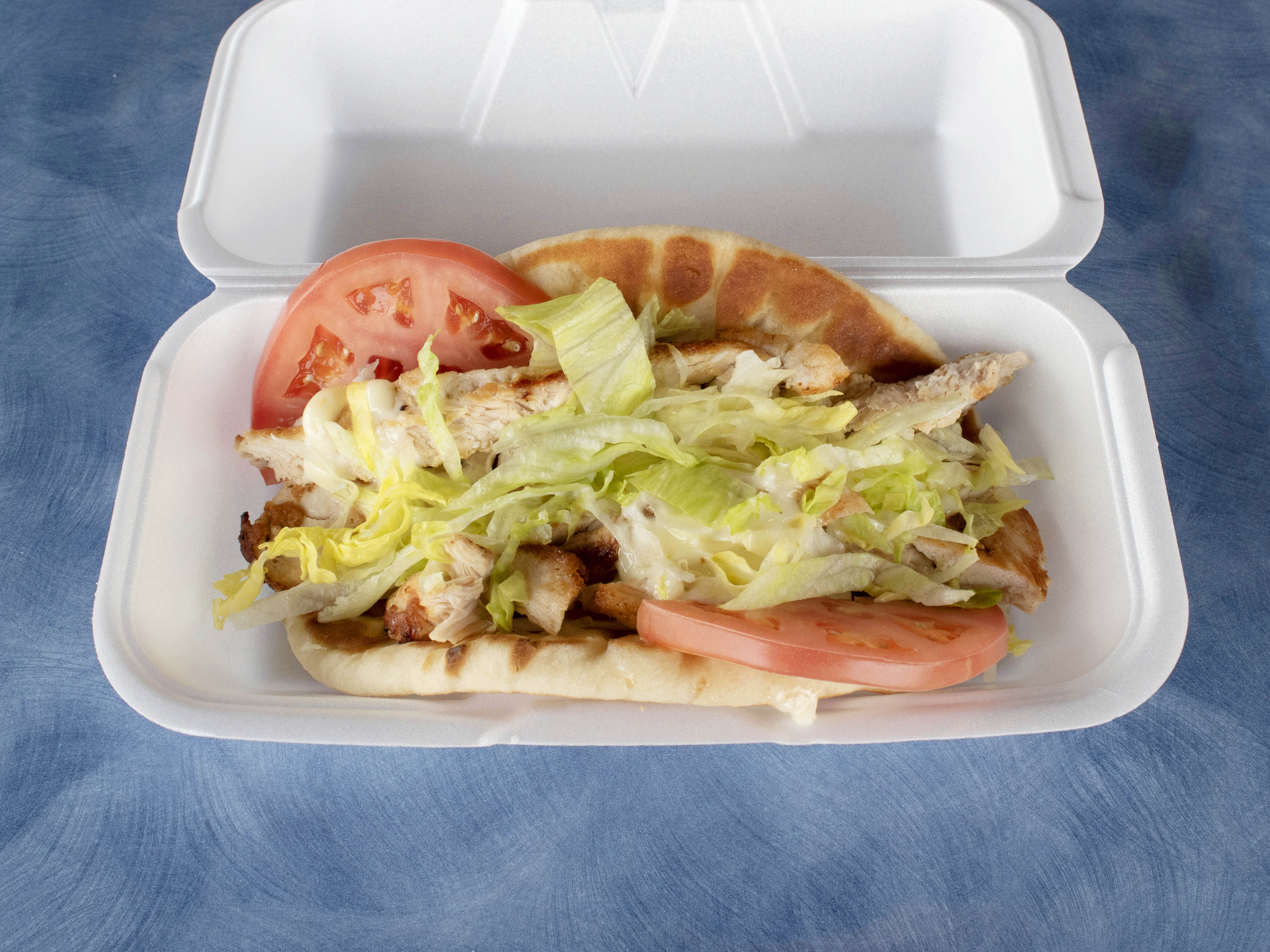 Order Chicken on Pita food online from Pluto's Beef & Hot Dogs store, Oak Lawn on bringmethat.com