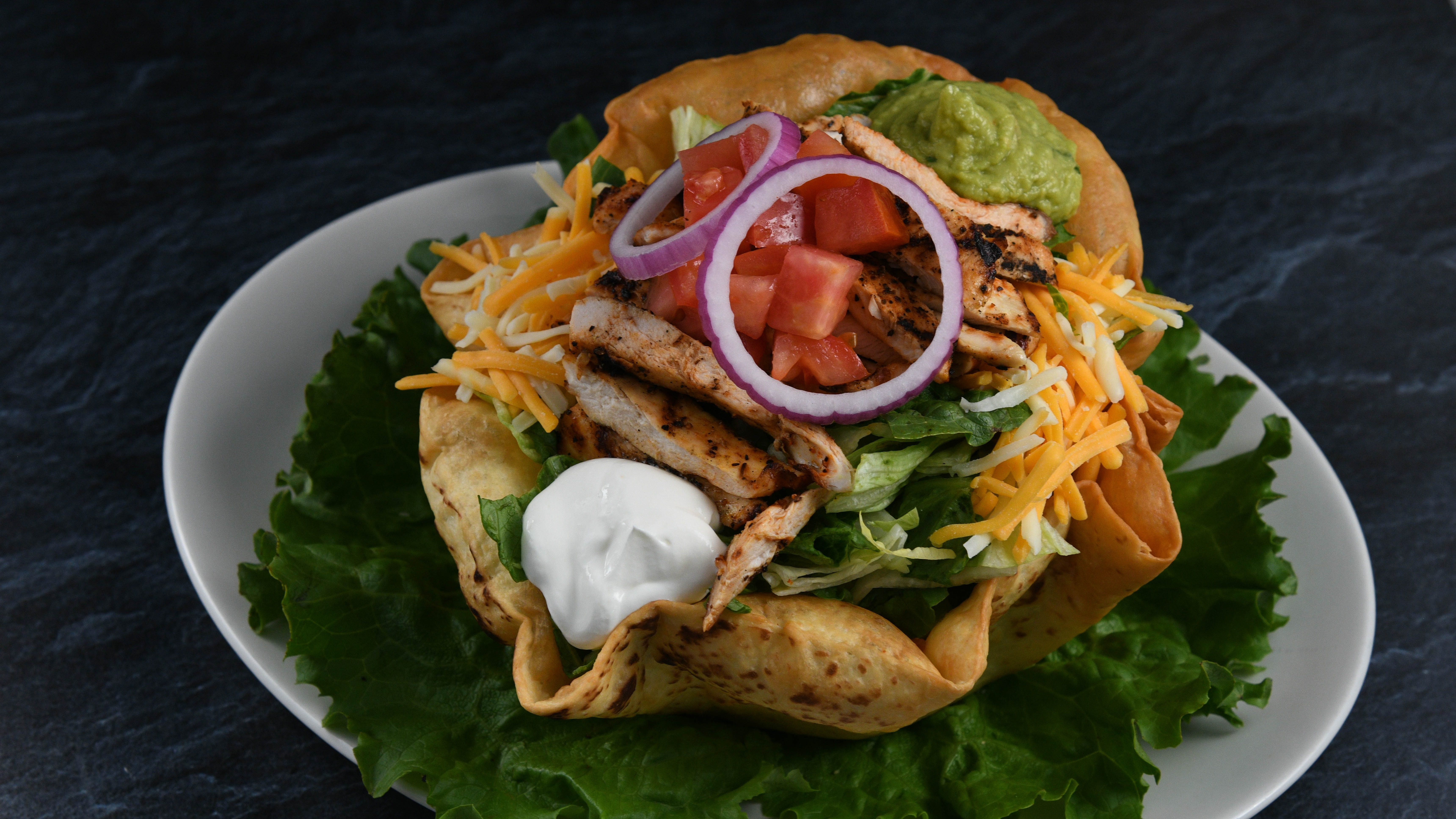 Order Taco Salad Chicken food online from Rainforest Cafe store, Tempe on bringmethat.com