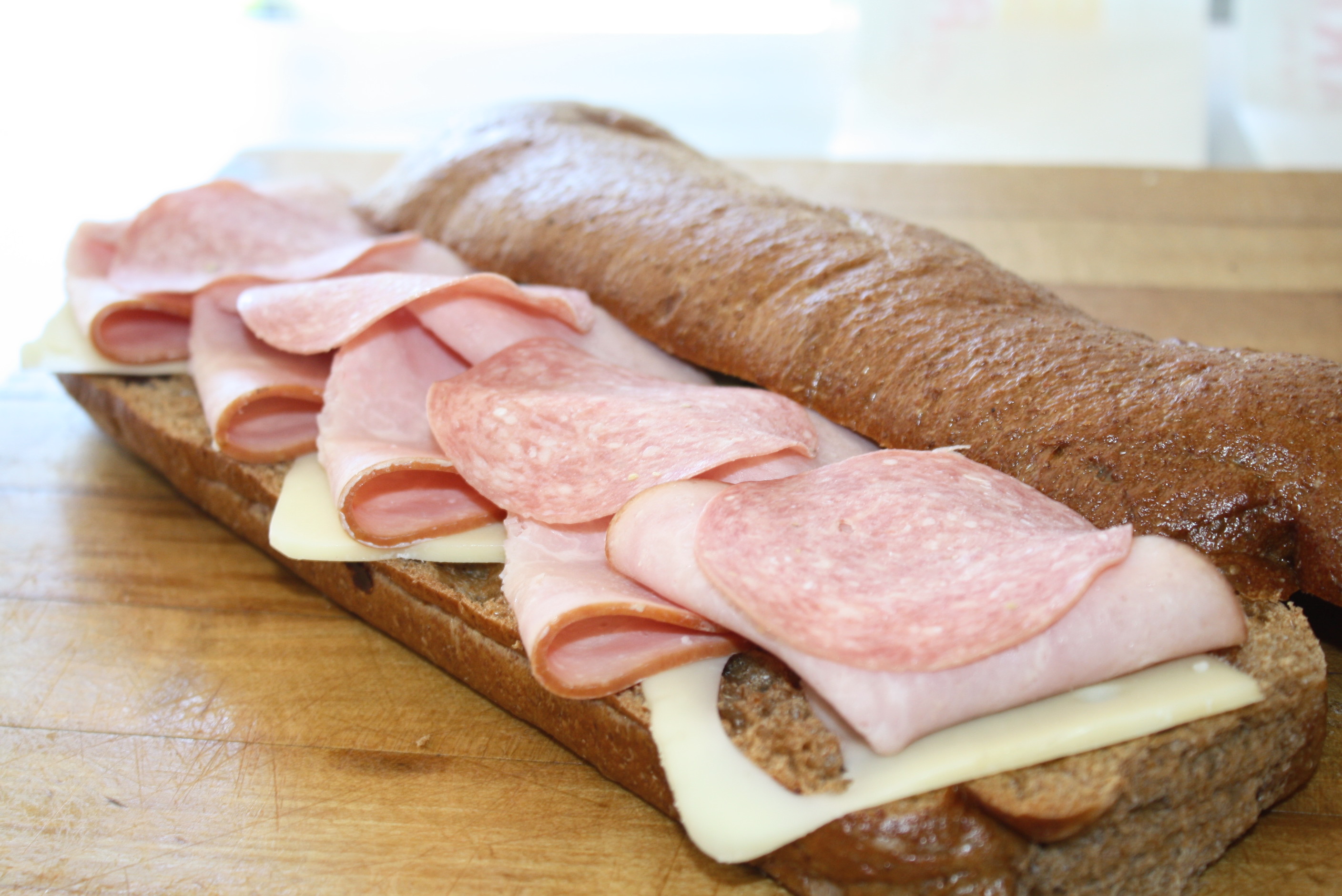 Order 2. Ham and Salami Sub food online from College Sub Shop store, San Diego on bringmethat.com