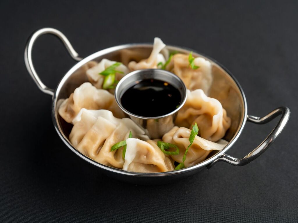 Order 9. Steamed Dumplings  food online from China Wok store, Madison on bringmethat.com