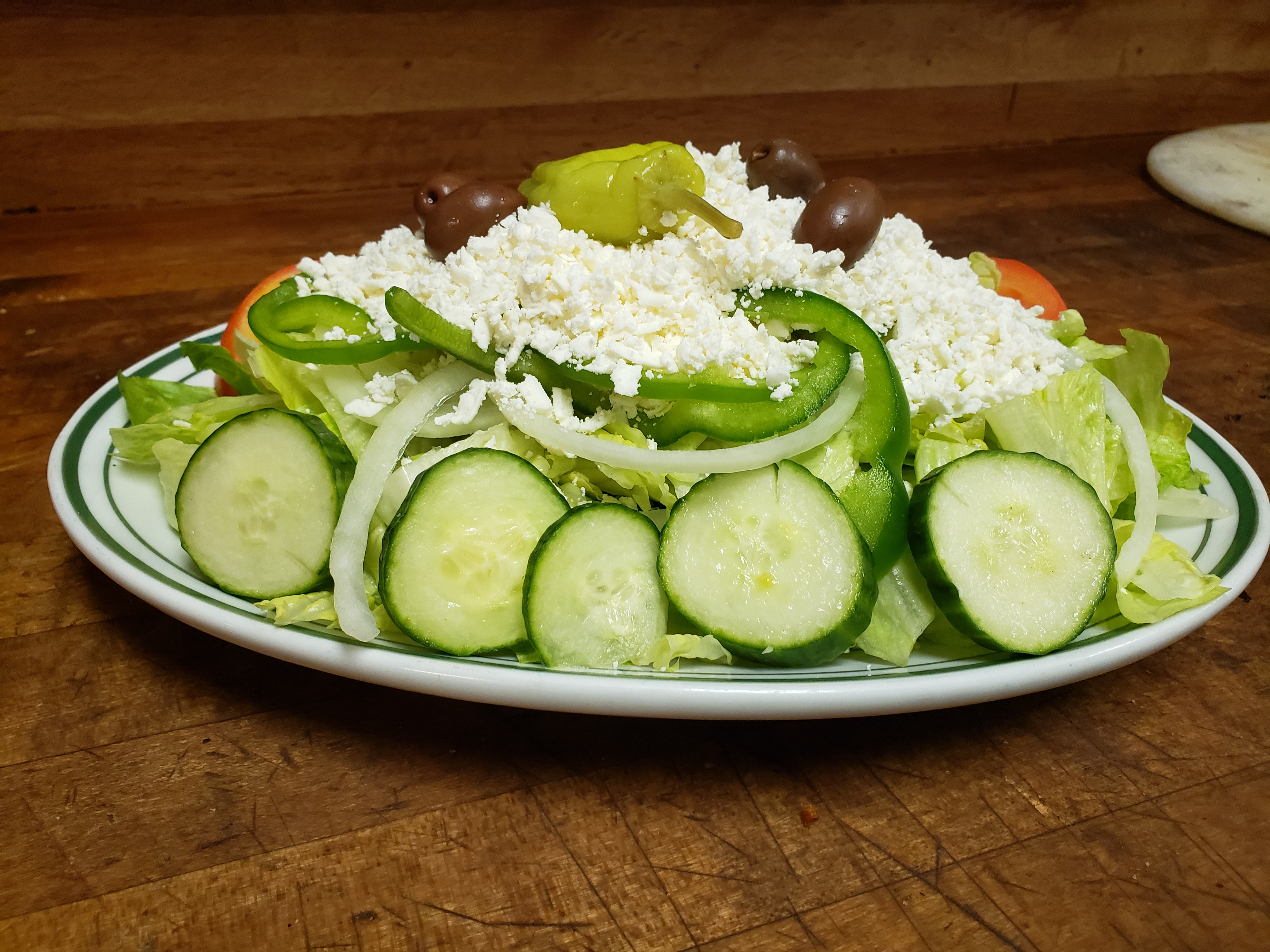 Order Greek Salad food online from Minervas Pizza store, Providence on bringmethat.com