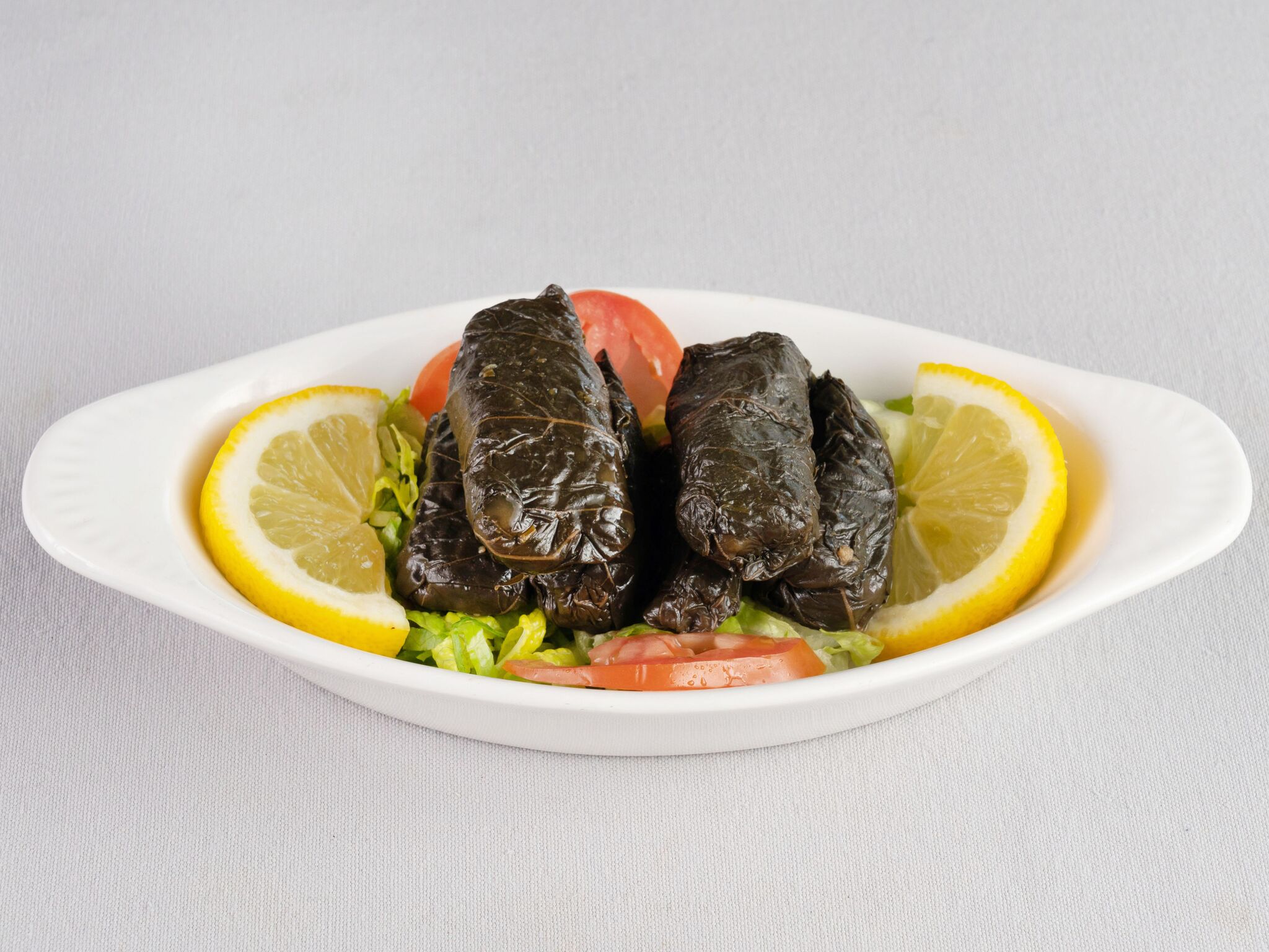 Order 6 Piece Grape Leaves food online from Rest House Cafe store, Houston on bringmethat.com